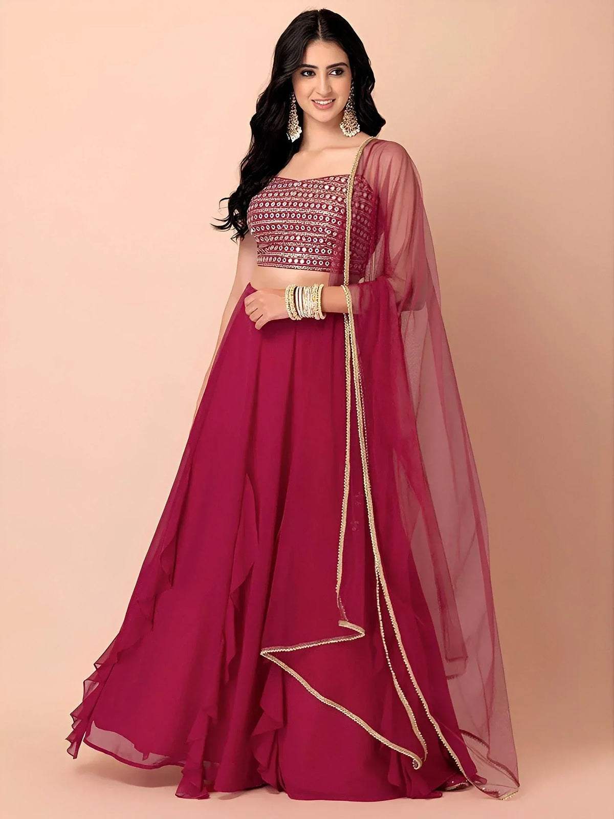 Elegant maroon lehenga choli with gold embroidery and sheer dupatta for Indian ethnic wear
