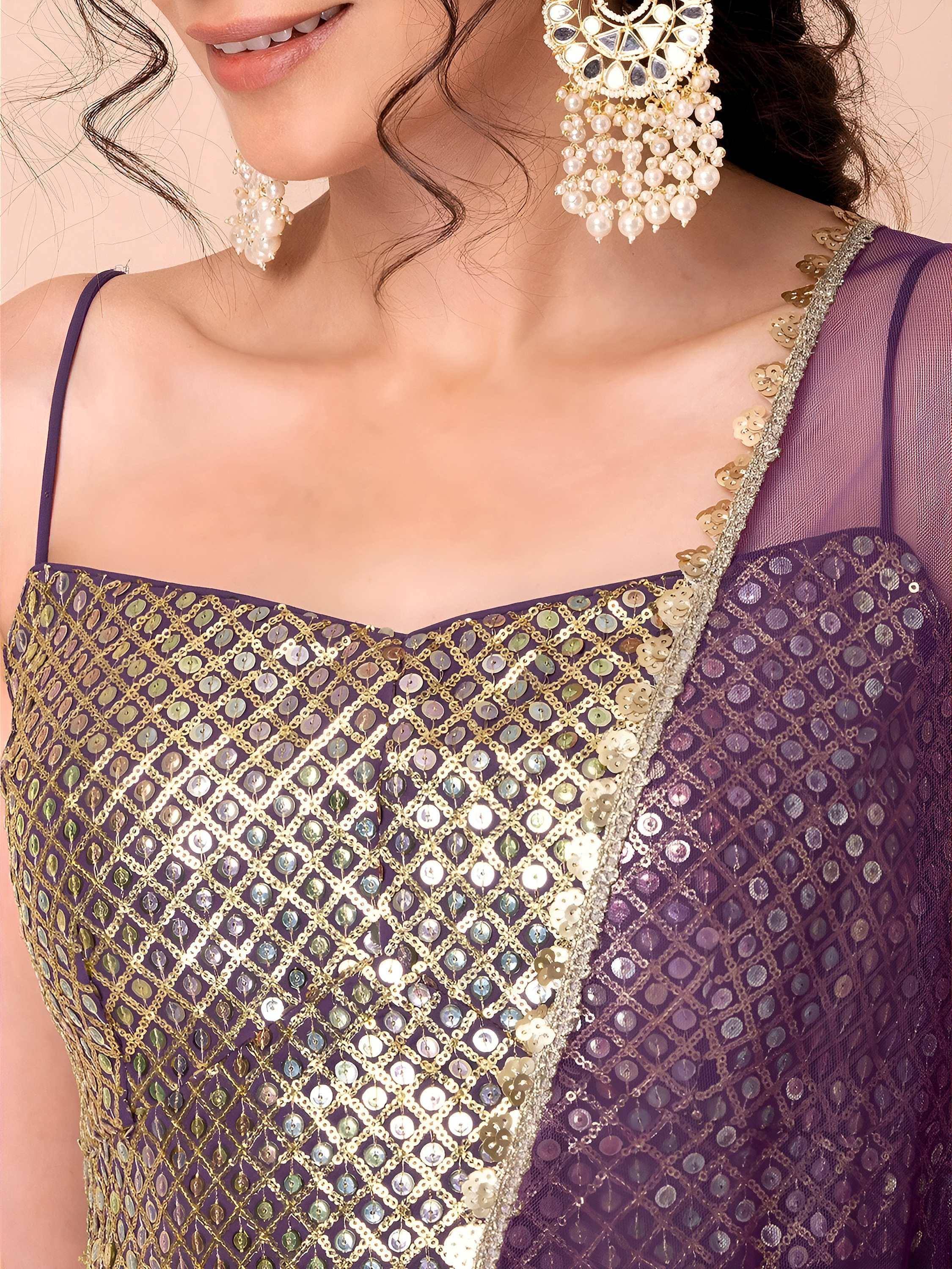 Purple ethnic gown with gold sequin detailing and pearl earrings