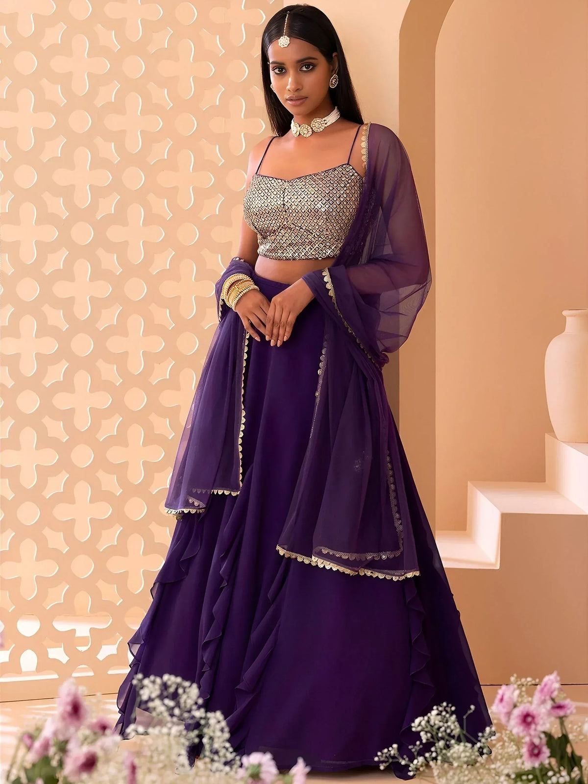 Purple ruffled lehenga choli with gold embroidery, perfect for Indian ethnic wear and festive occasions.