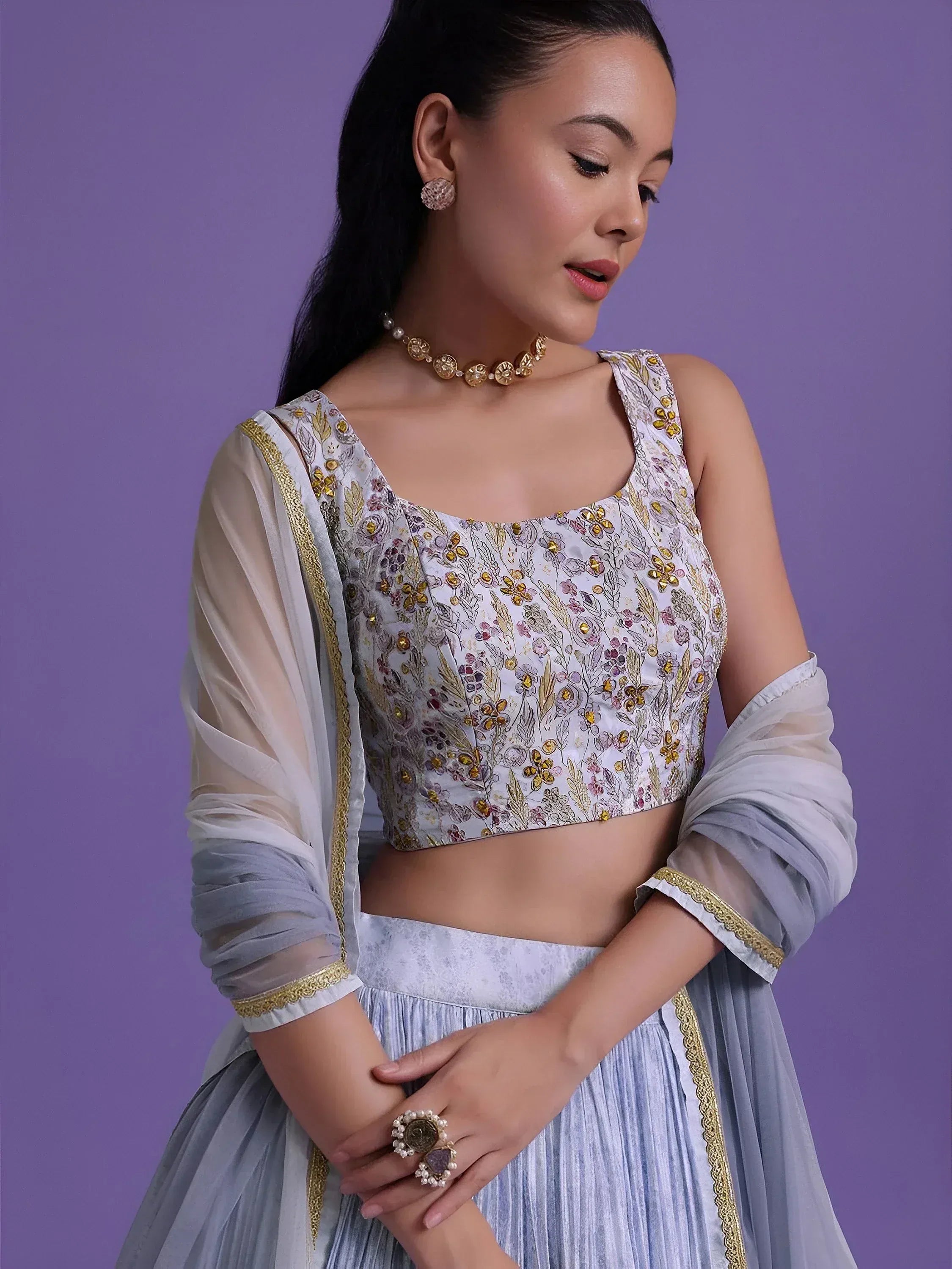 Elegant floral embroidered lehenga choli with sheer dupatta, perfect for Indian ethnic wear occasions.