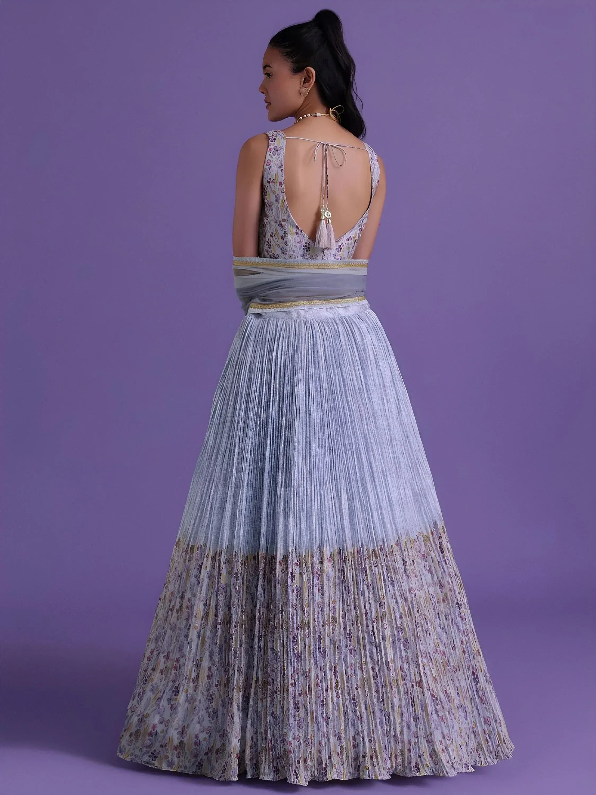 Floral print ethnic gown with pleated skirt and open back, perfect for Indian occasions
