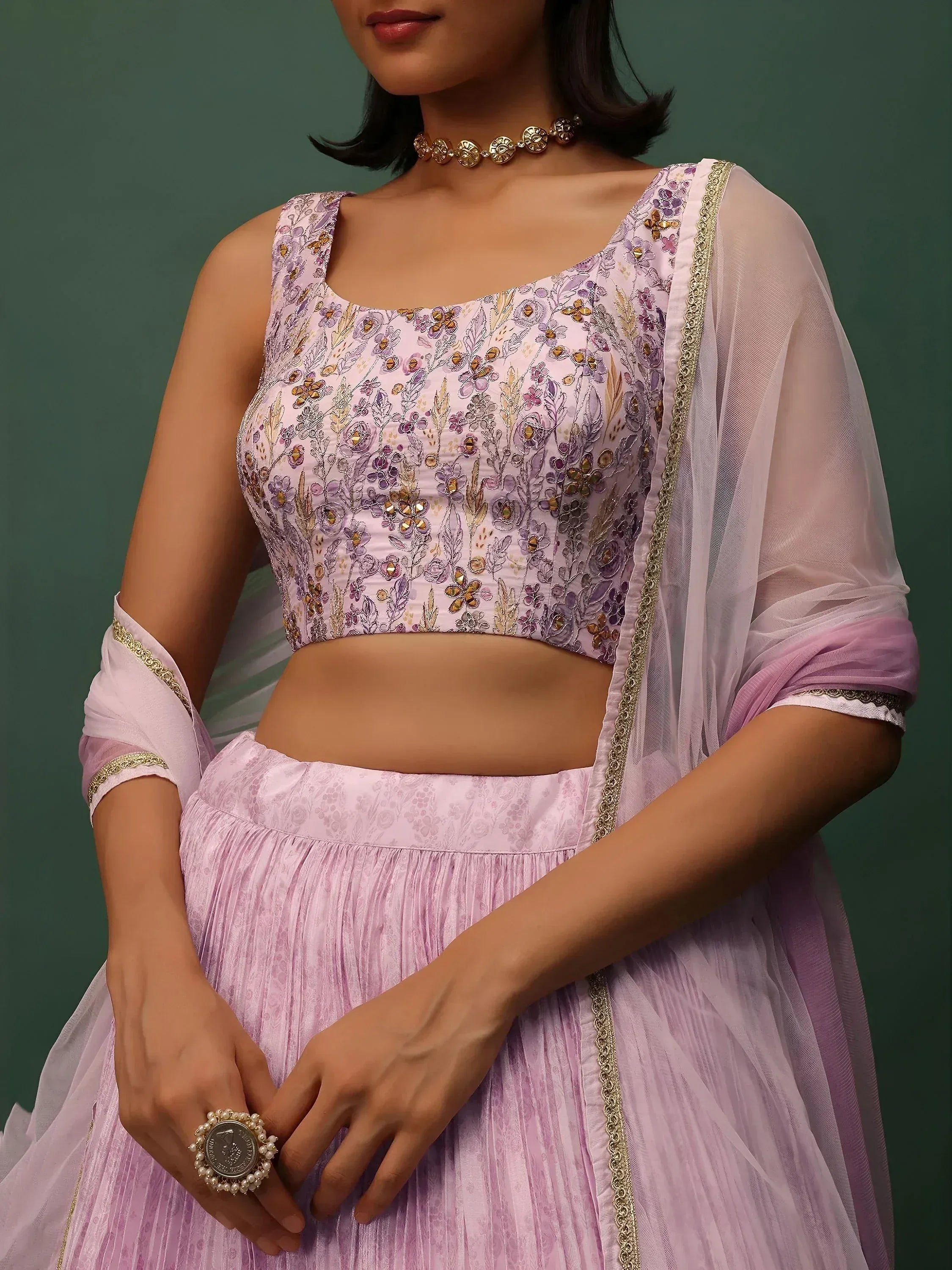 Lavender floral embroidered lehenga choli with sheer dupatta, perfect for Indian ethnic wear occasions.