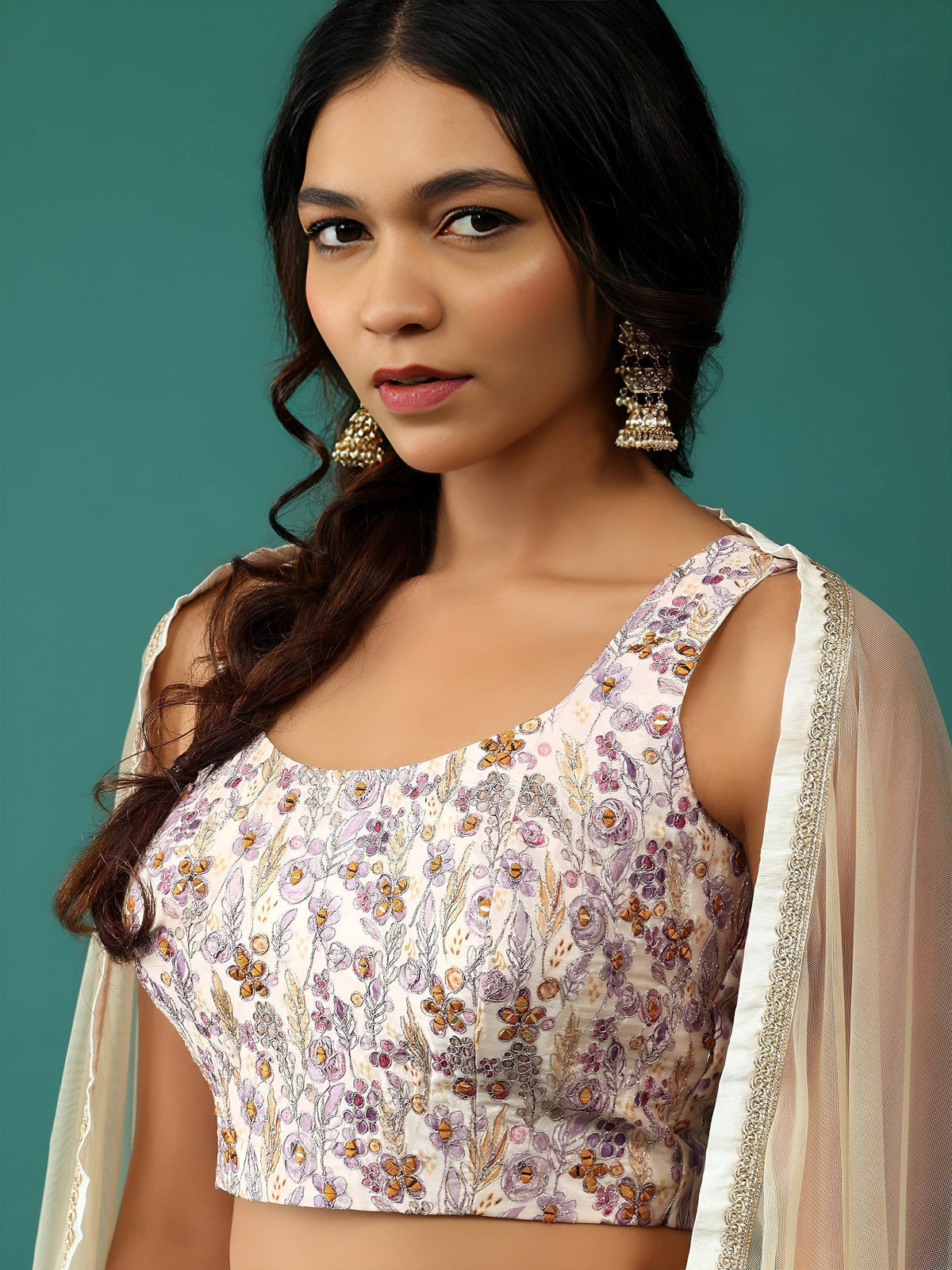 Floral embroidered ethnic blouse with sheer dupatta, perfect for Indian weddings and festive occasions.