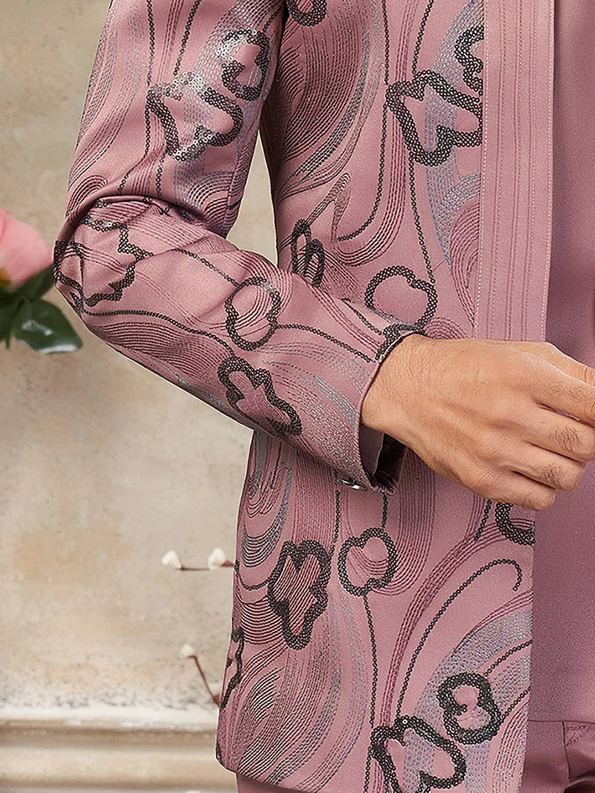 Pink ethnic kurta with intricate black and silver threadwork, perfect for festive occasions.