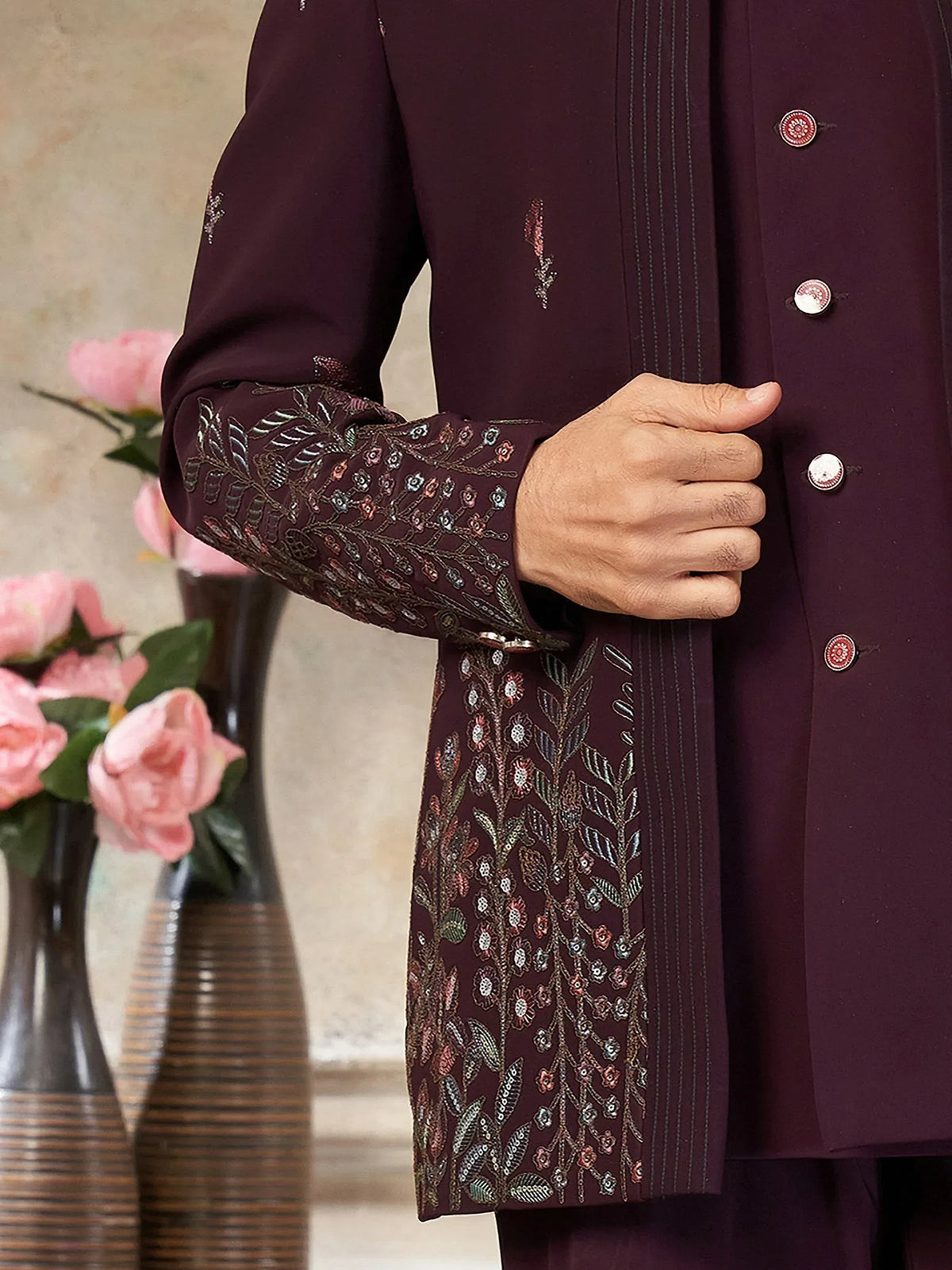 Elegant maroon sherwani with intricate floral embroidery, perfect for Indian ethnic wear occasions.