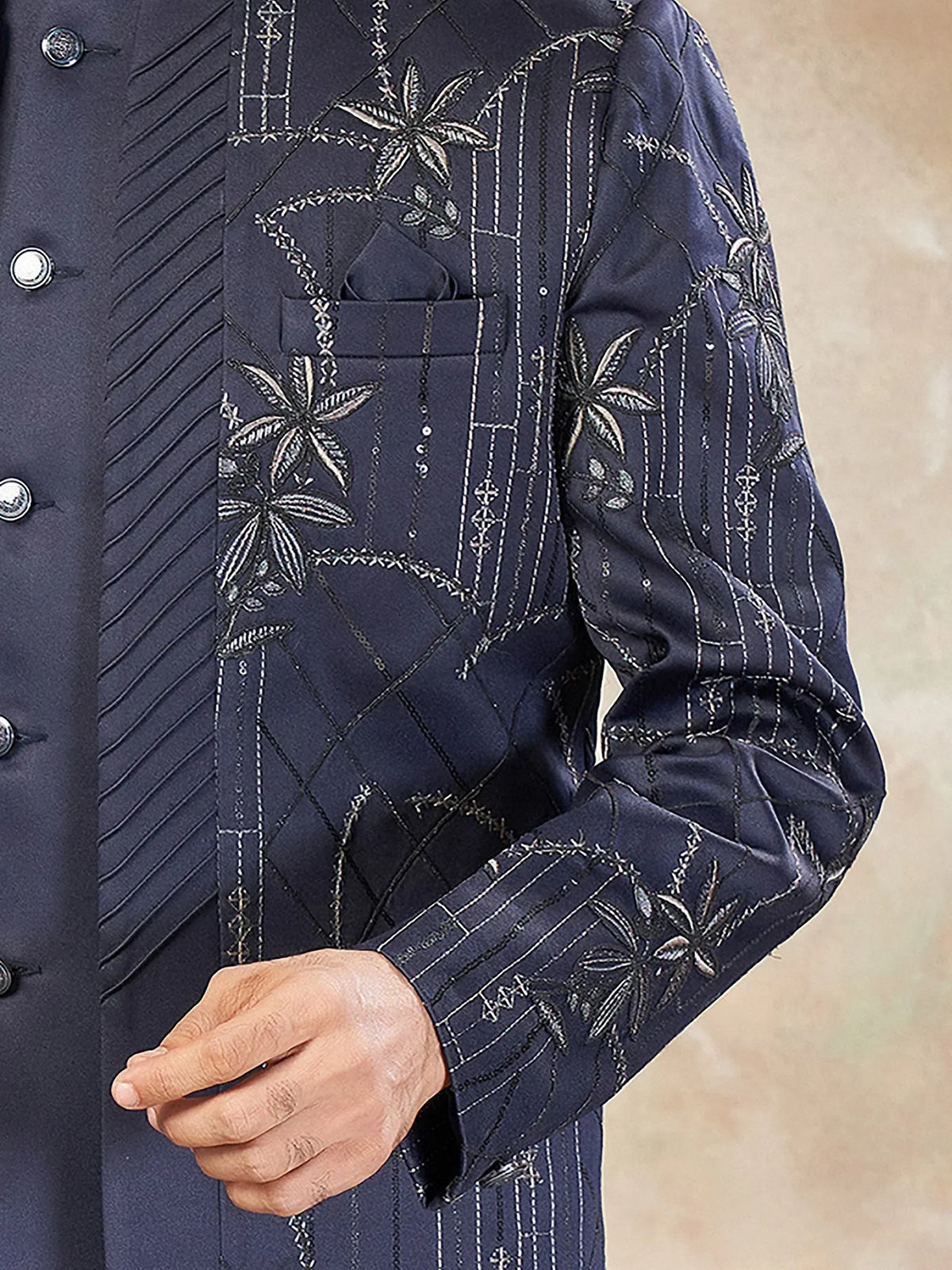 Navy blue embroidered sherwani with floral and geometric patterns, perfect for ethnic occasions.