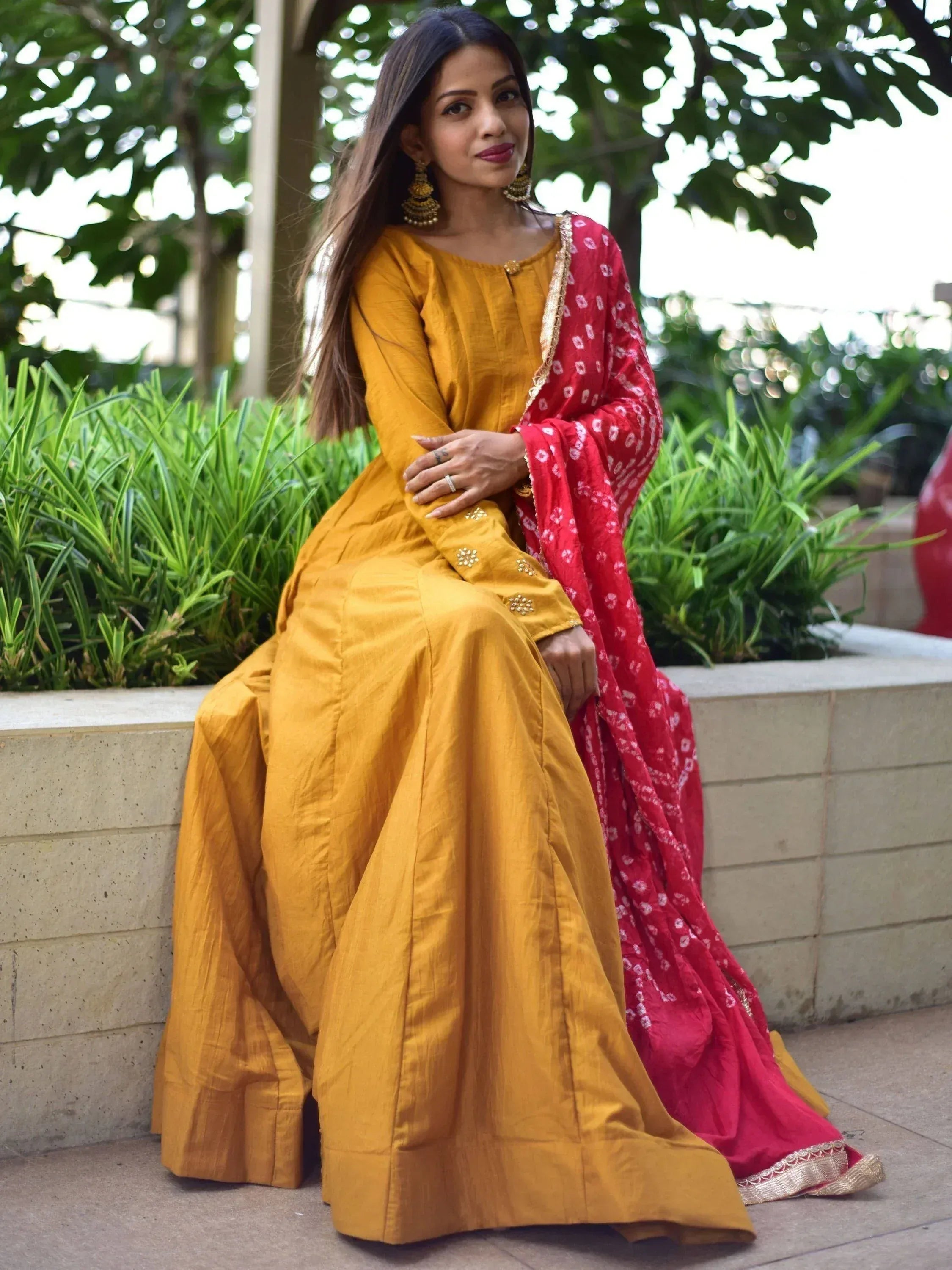 Yellow ethnic gown with red dupatta, perfect for Indian festive occasions and designer wear