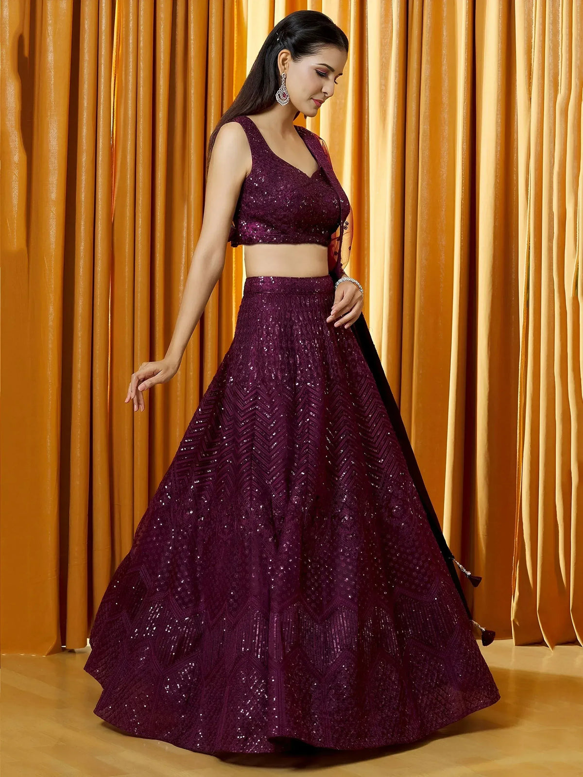 Elegant purple sequin lehenga choli with V-neck blouse, perfect for Indian weddings and festive occasions.