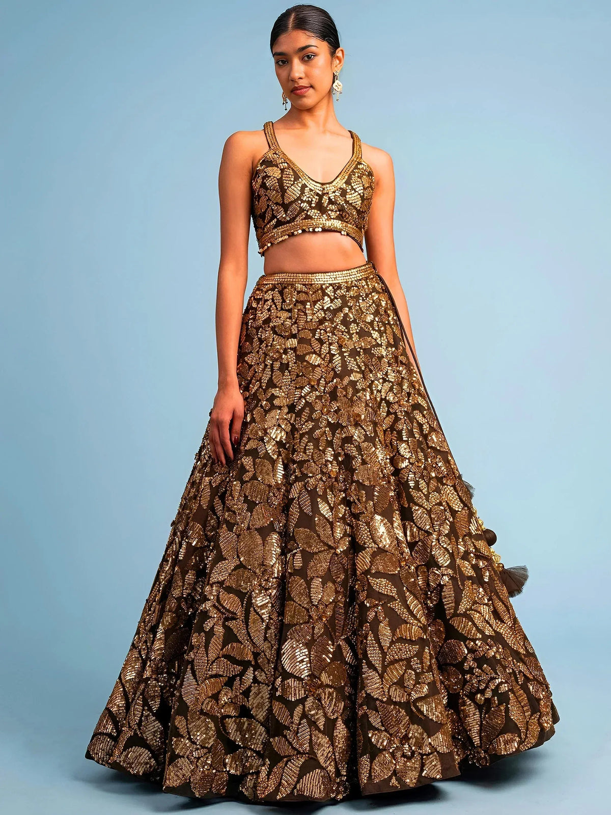 Gold embroidered lehenga choli with leaf pattern, Indian ethnic wear for weddings and parties