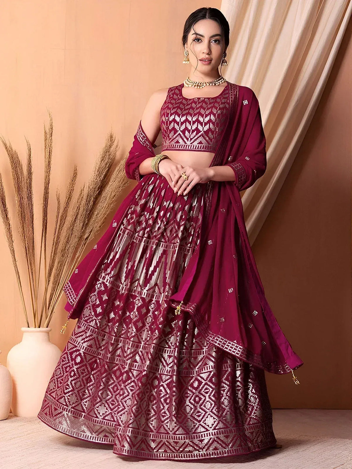 Maroon embroidered lehenga choli with geometric patterns, perfect for Indian ethnic wear occasions