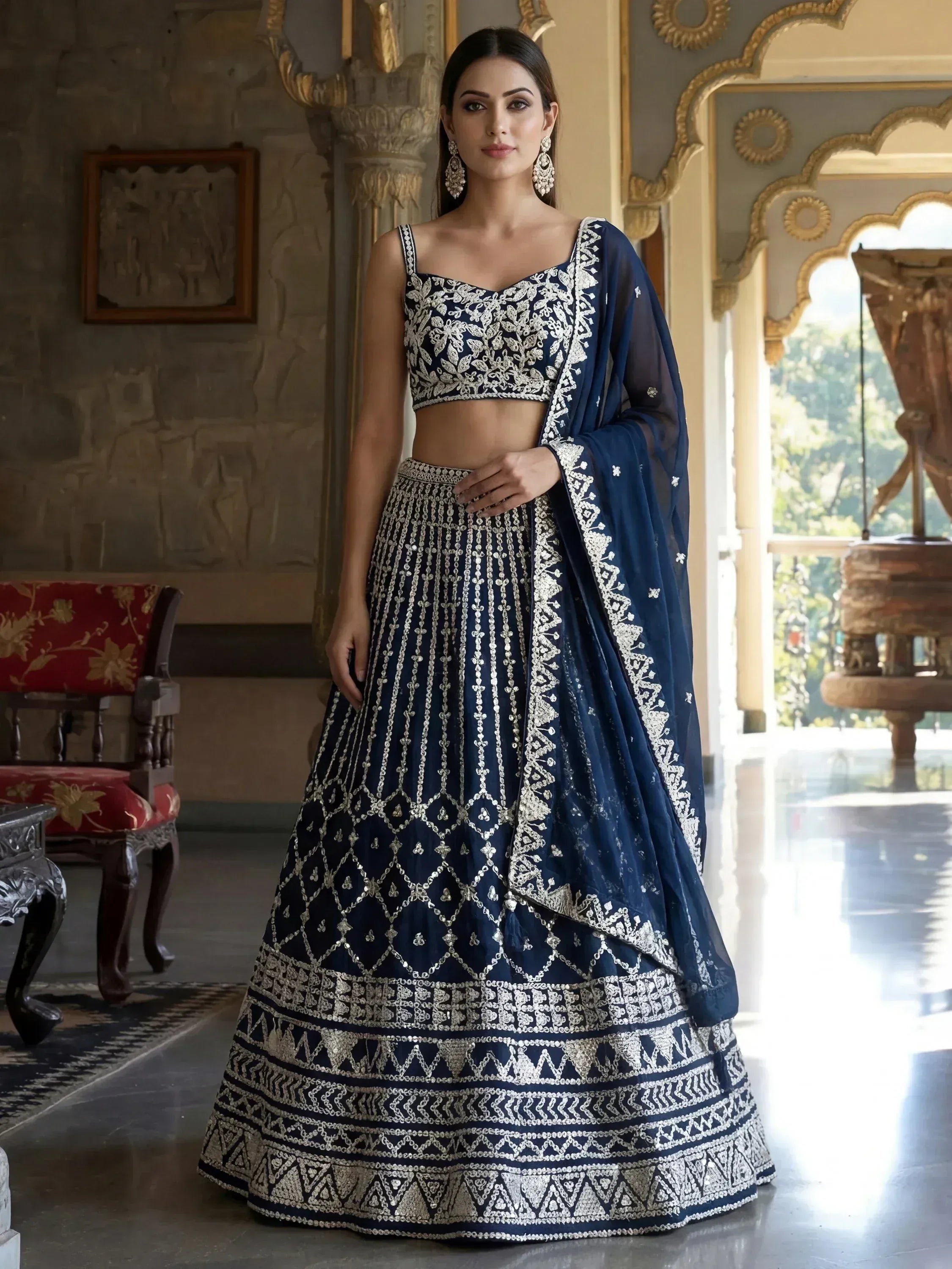 Navy blue designer lehenga choli with silver embroidery, perfect for Indian weddings and festive occasions.