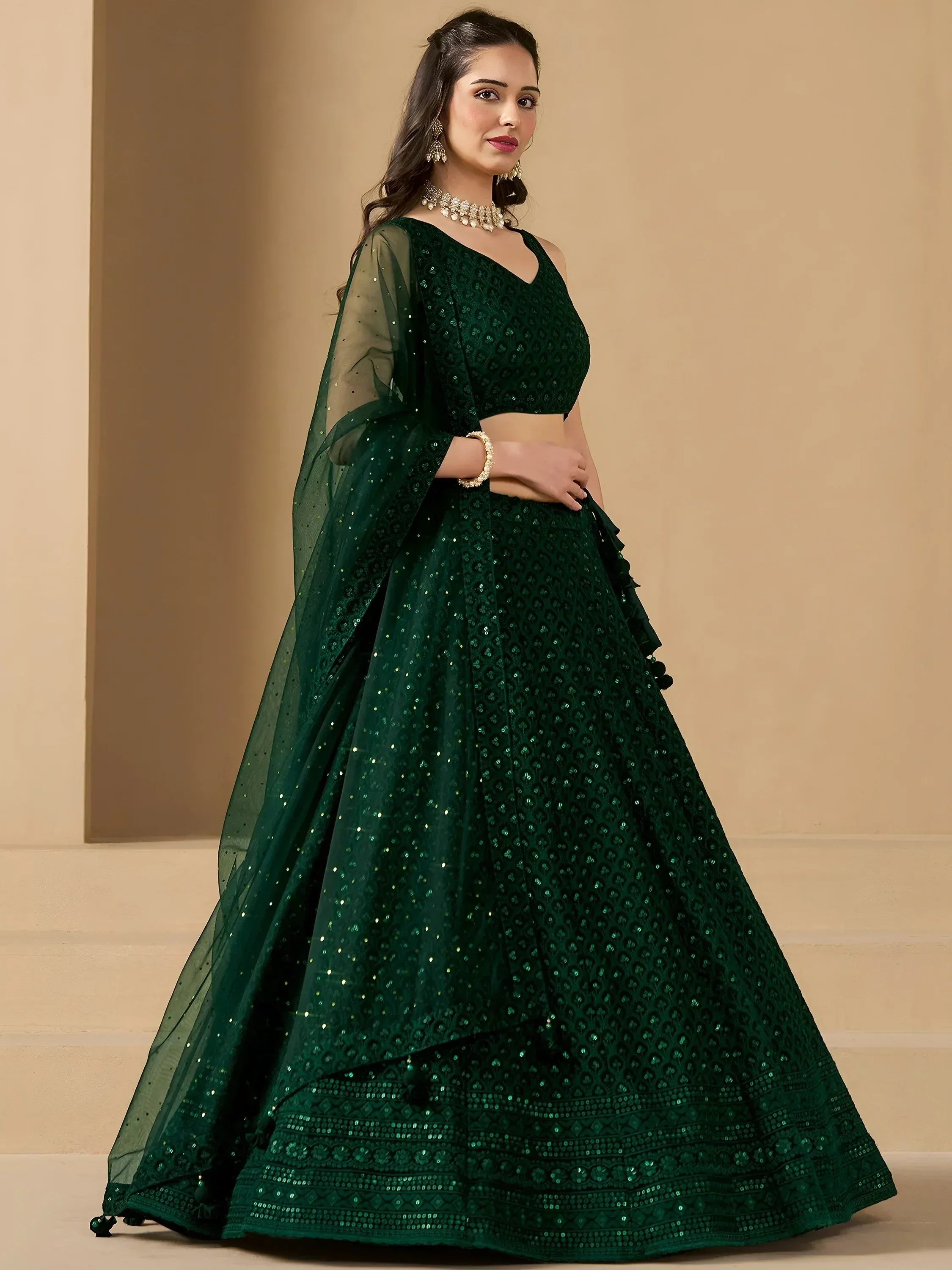 Emerald green designer lehenga choli with sequin embroidery and sheer dupatta for Indian ethnic wear