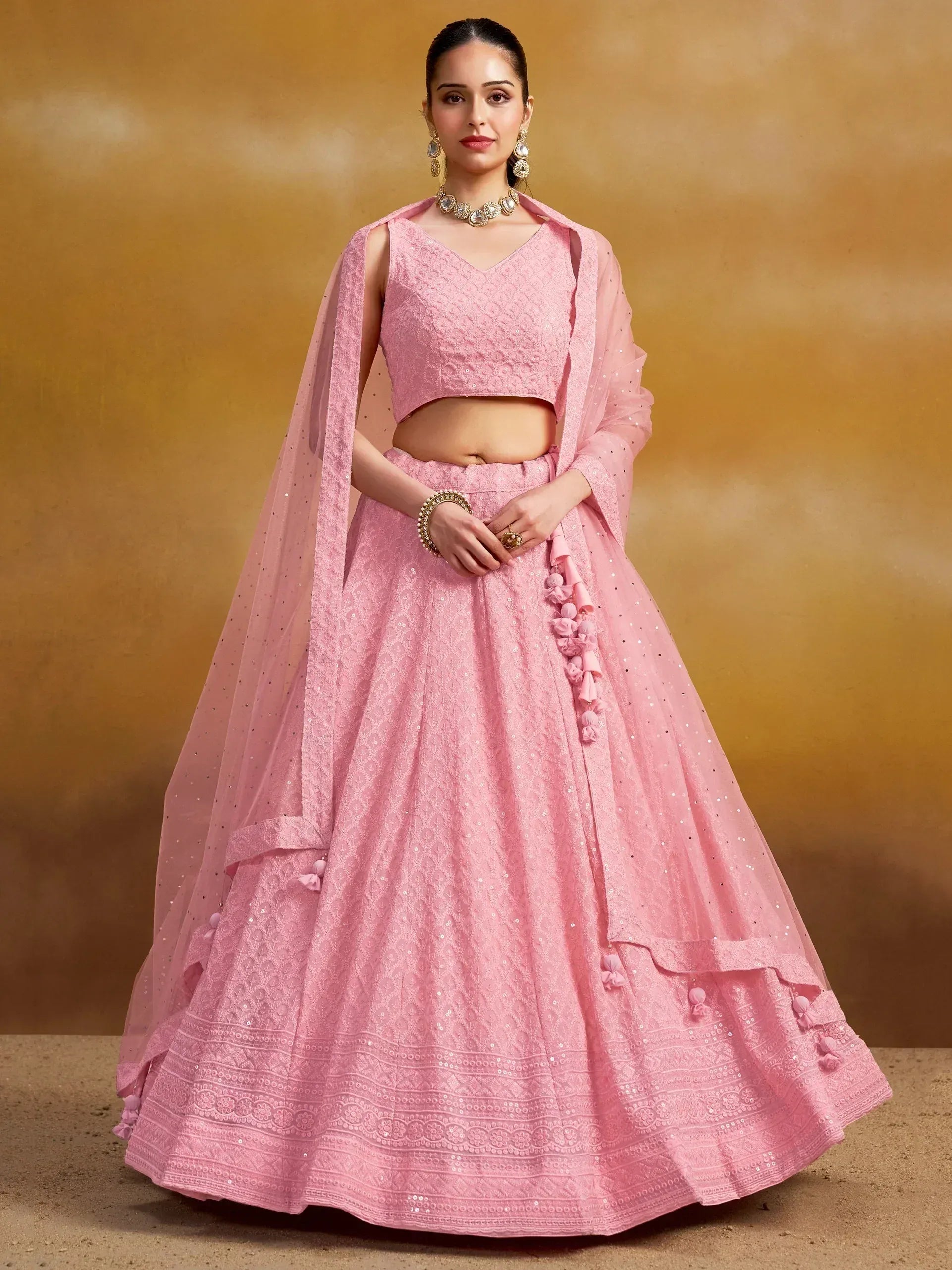 Pink embroidered lehenga choli with sequins and tassels, perfect for Indian ethnic wear occasions