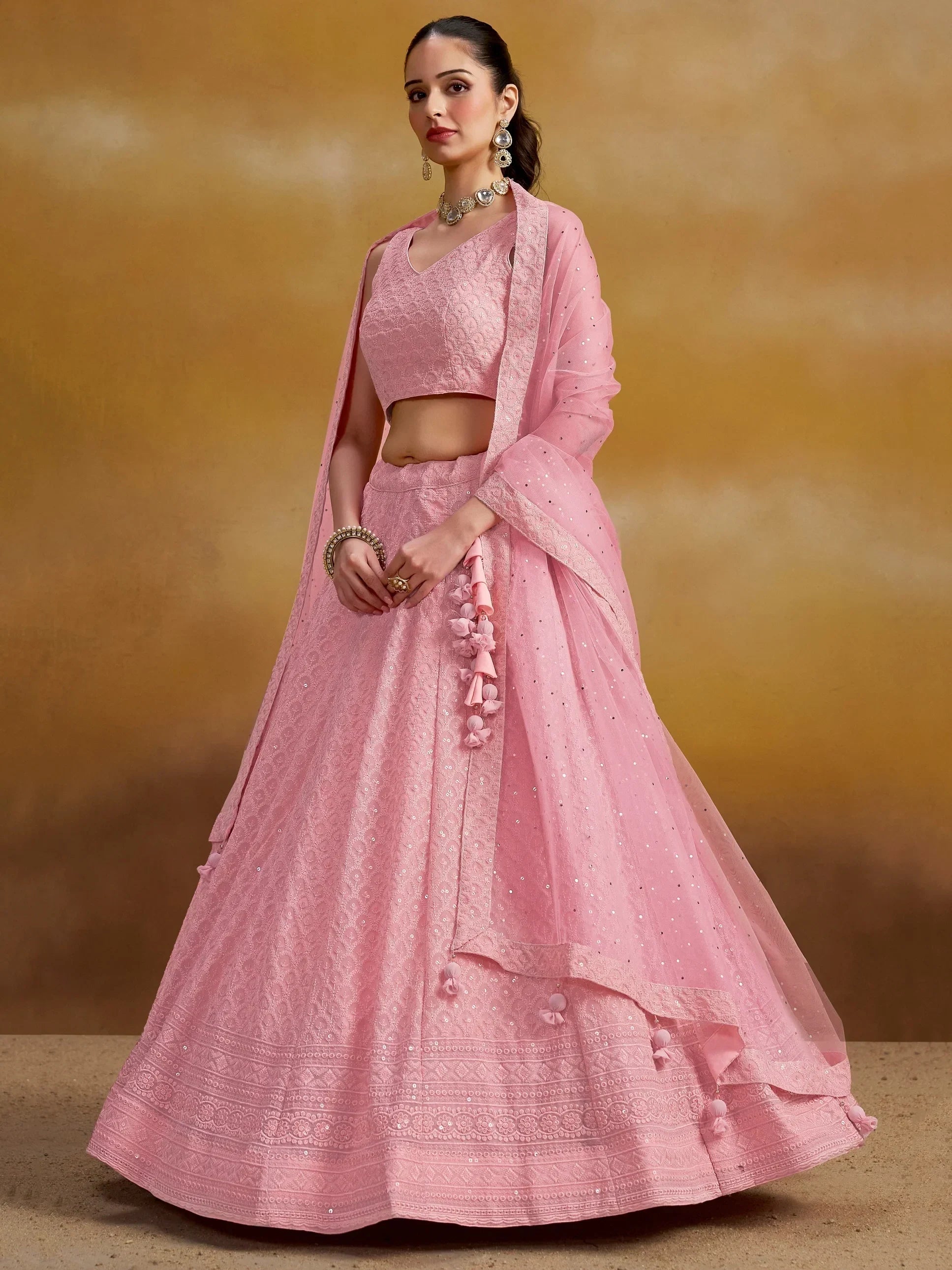 Pink designer lehenga choli with sequins and tassels, perfect for Indian ethnic wear occasions