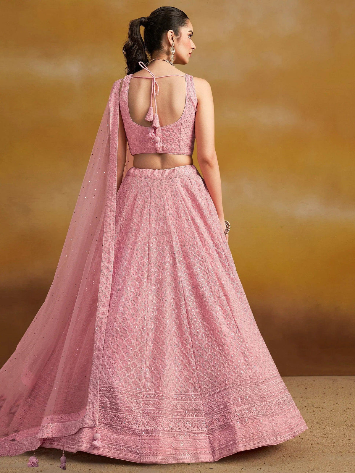 Pink designer lehenga choli with sequin work, back tie blouse, and sheer dupatta for Indian ethnic wear
