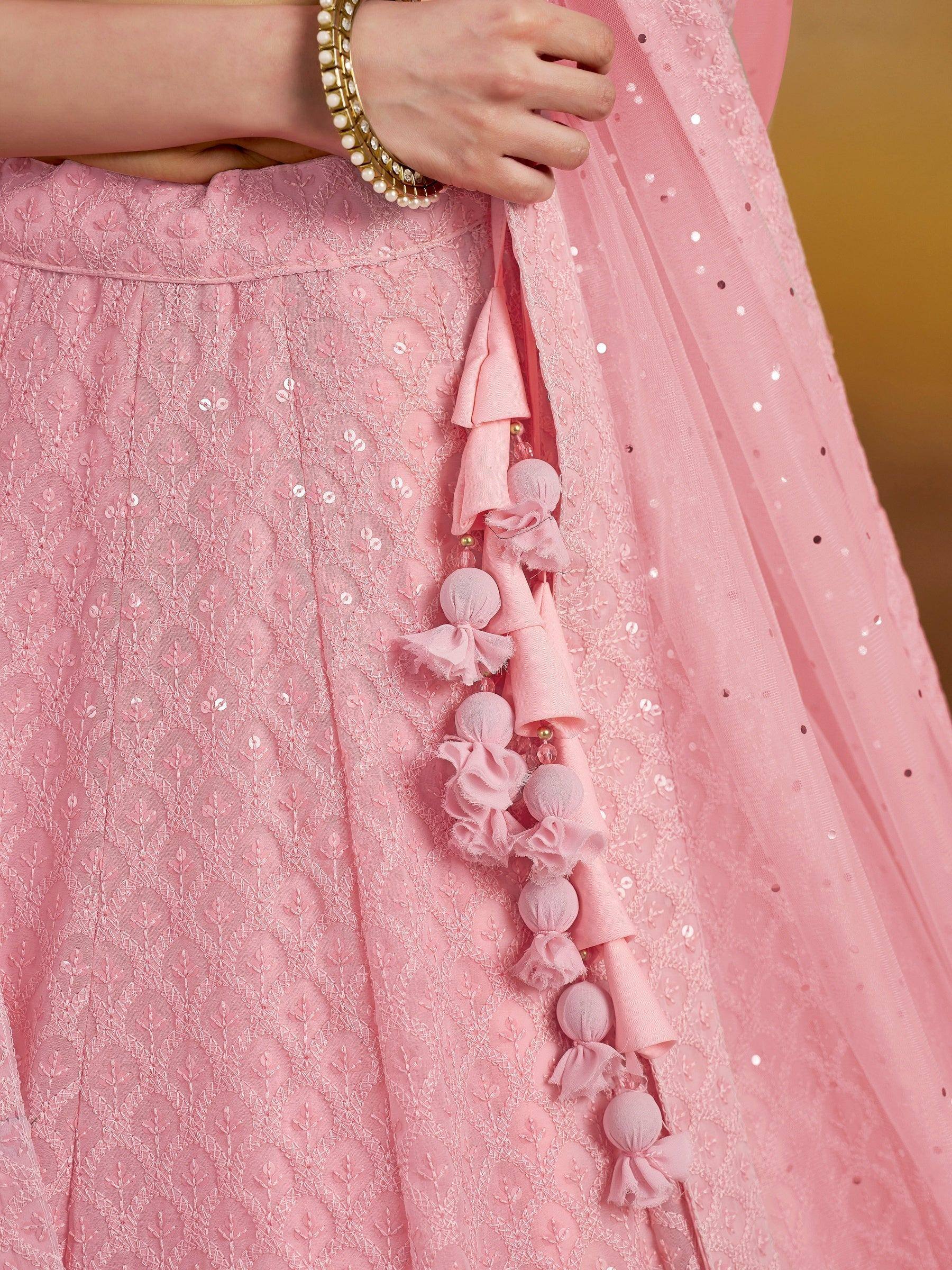 Pink embroidered lehenga with sequins and tassel details, perfect for Indian ethnic wear occasions.