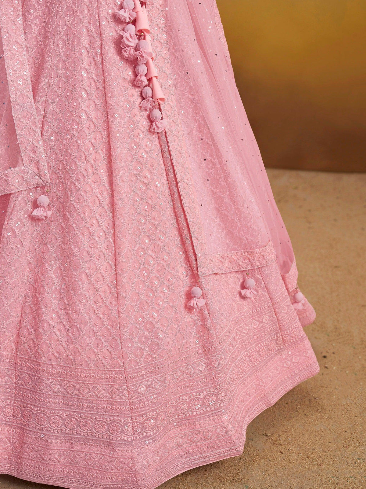 Pink embroidered lehenga with sequins and tassel details, ideal for Indian ethnic wear occasions