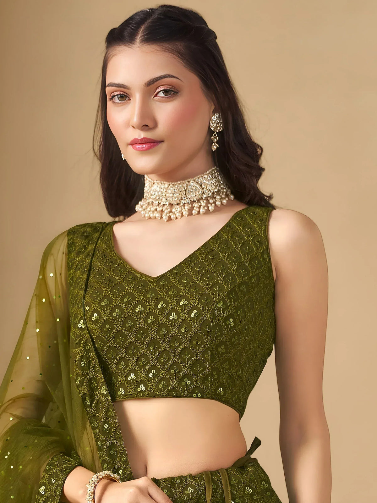 Olive green embroidered lehenga choli with sequins and pearl jewelry