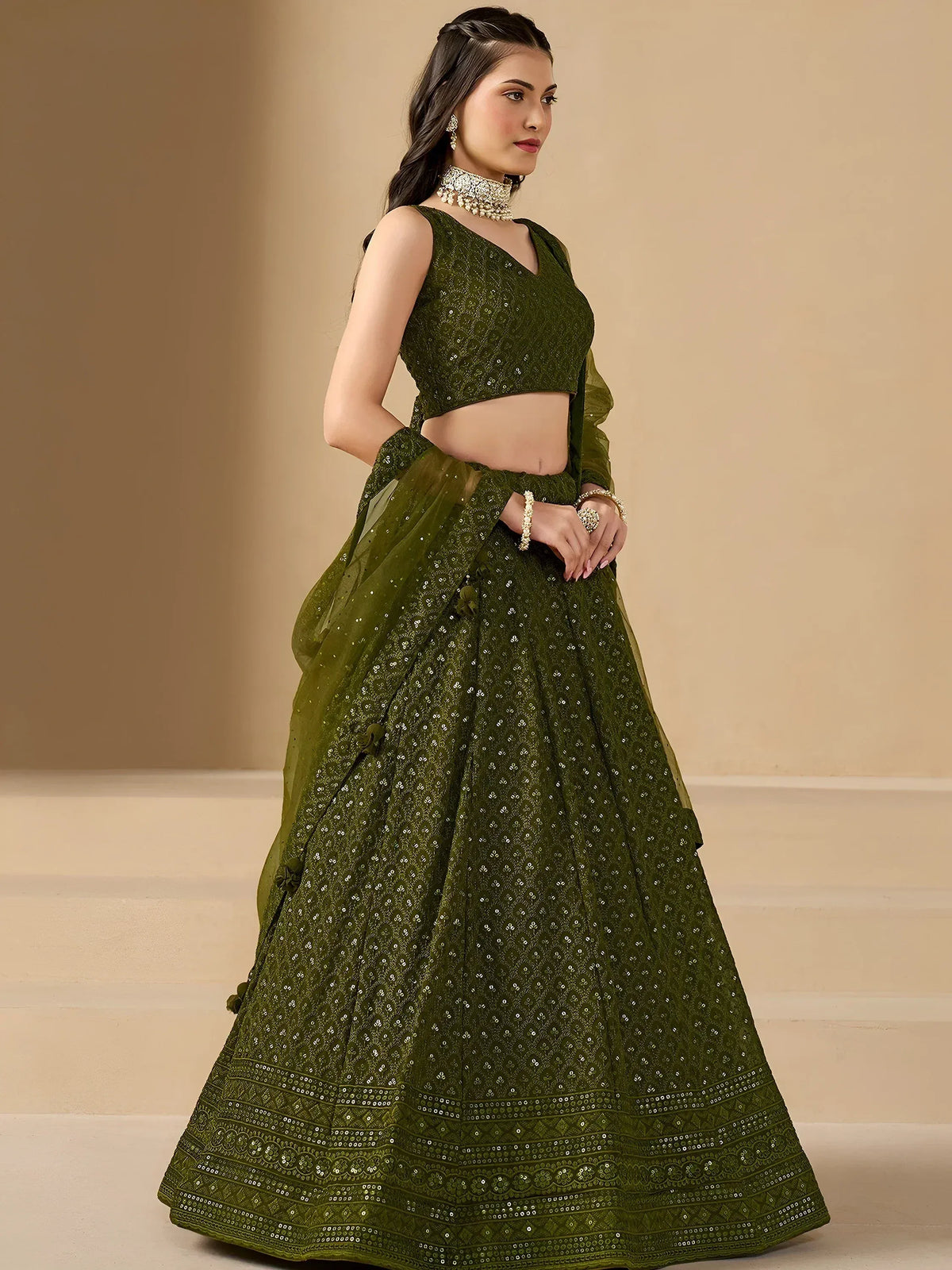 Olive green embroidered lehenga choli with sequins and floral detailing for festive occasions