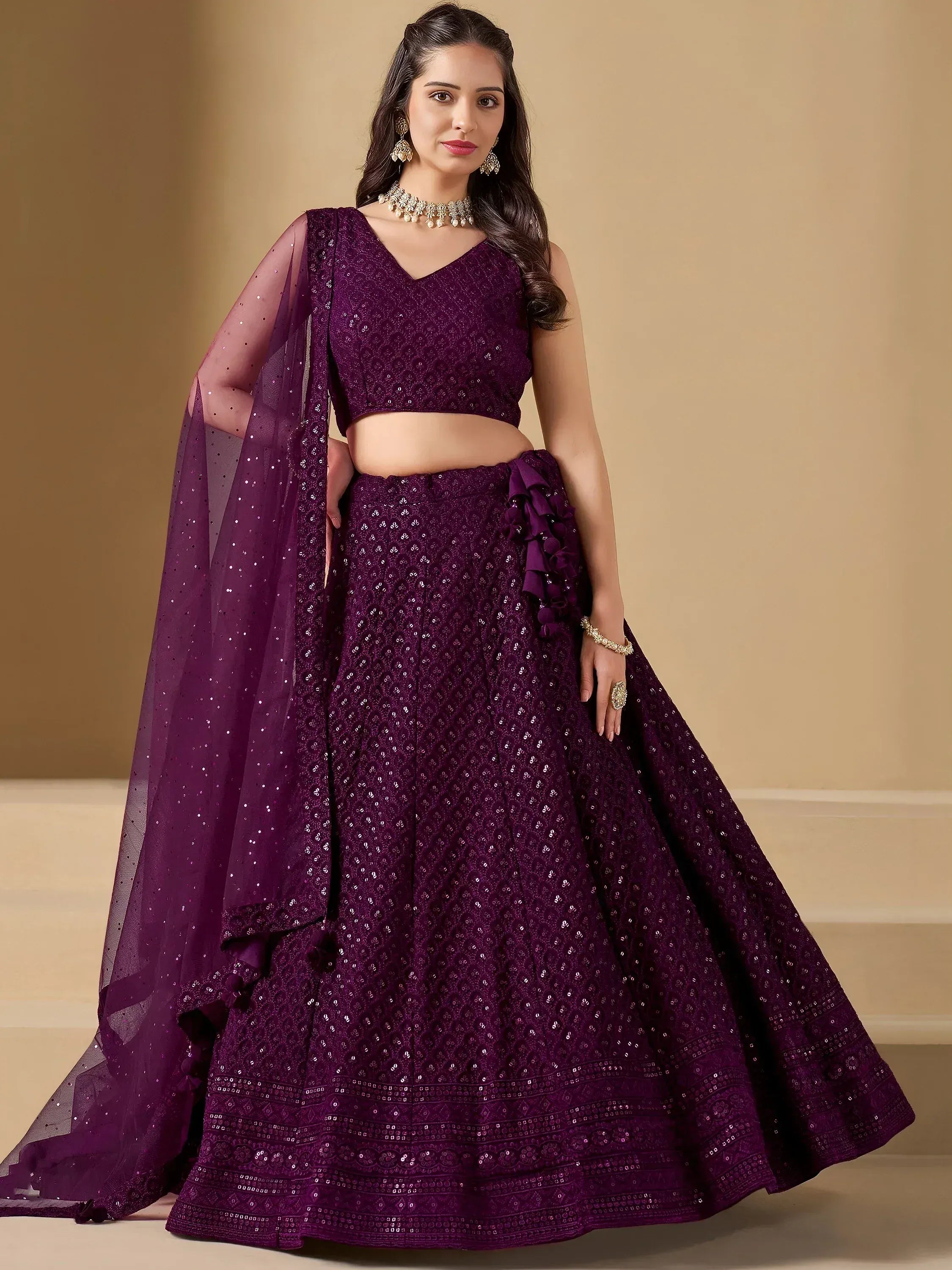 Purple sequin lehenga choli with ruffle detailing and sheer dupatta, perfect for Indian ethnic occasions
