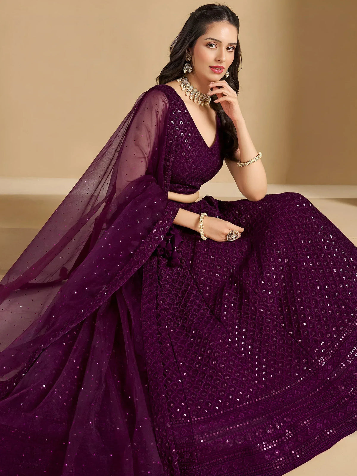 Purple sequin lehenga choli with sheer dupatta, perfect for Indian weddings and festive occasions.