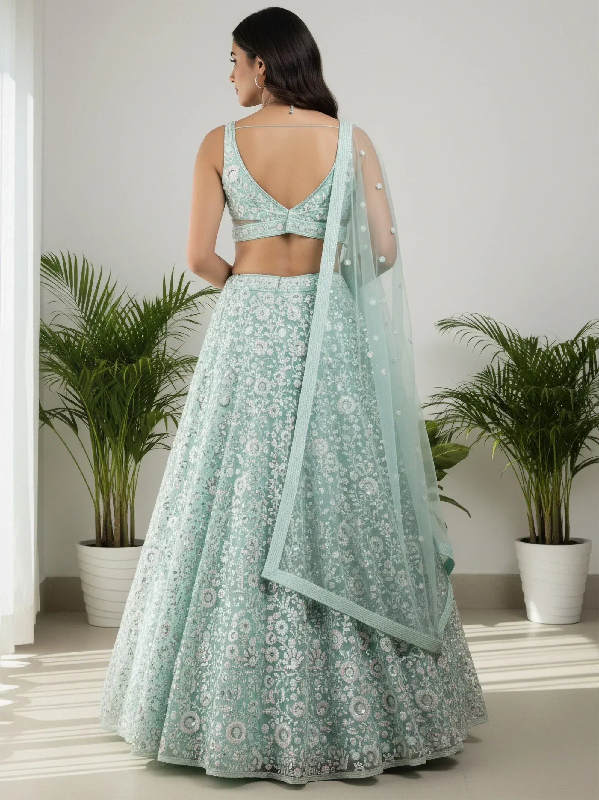 Sparkling Green Sequins Embroidered Net Reception Wear Lehenga Choli