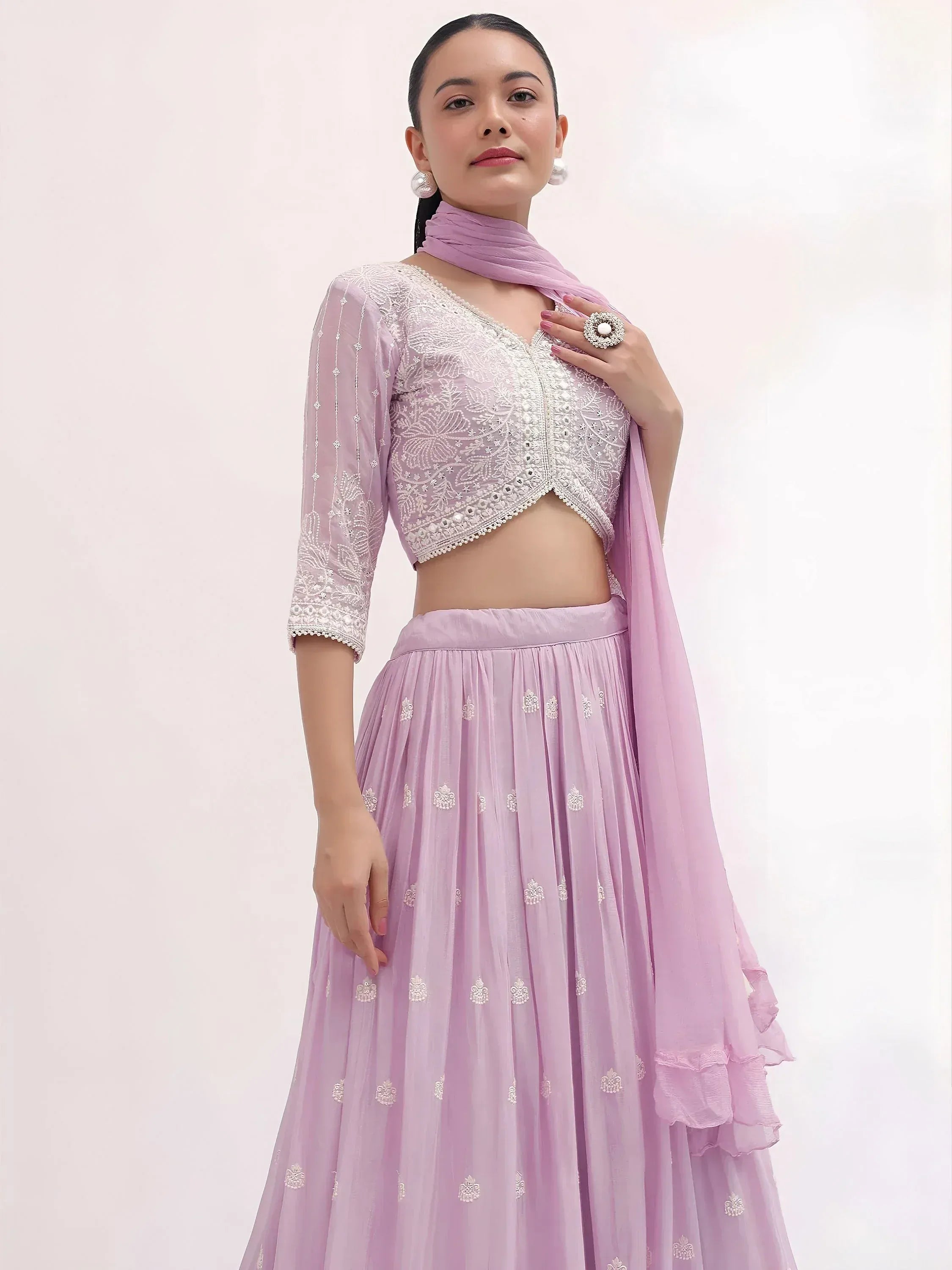 Elegant lavender lehenga choli with intricate embroidery and matching dupatta for festive occasions