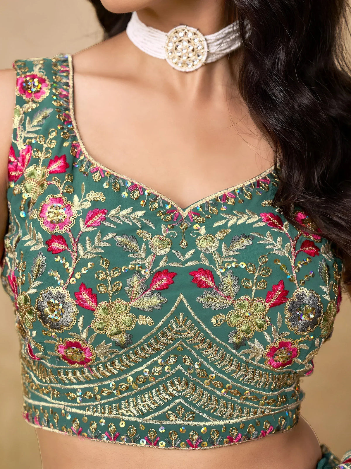 Teal floral embroidered blouse with gold thread and sequins, perfect for Indian ethnic wear