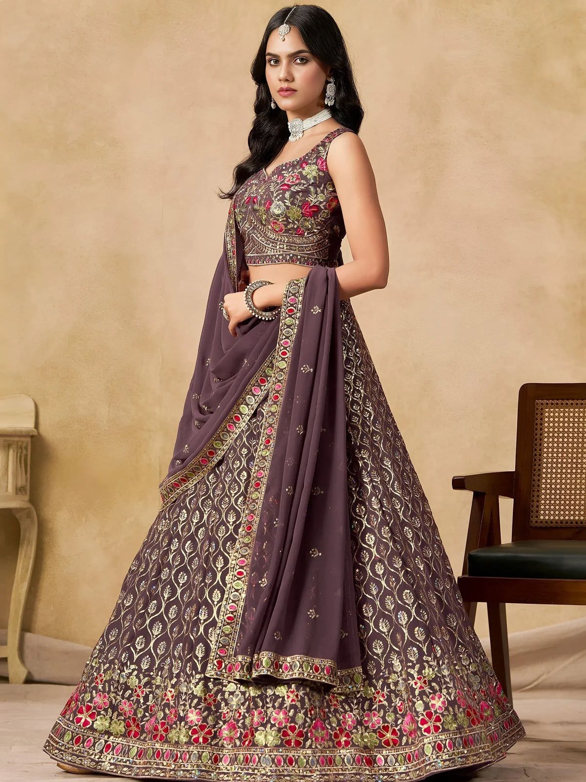 Elegant purple lehenga choli with floral embroidery and gold detailing, perfect for Indian ethnic occasions.