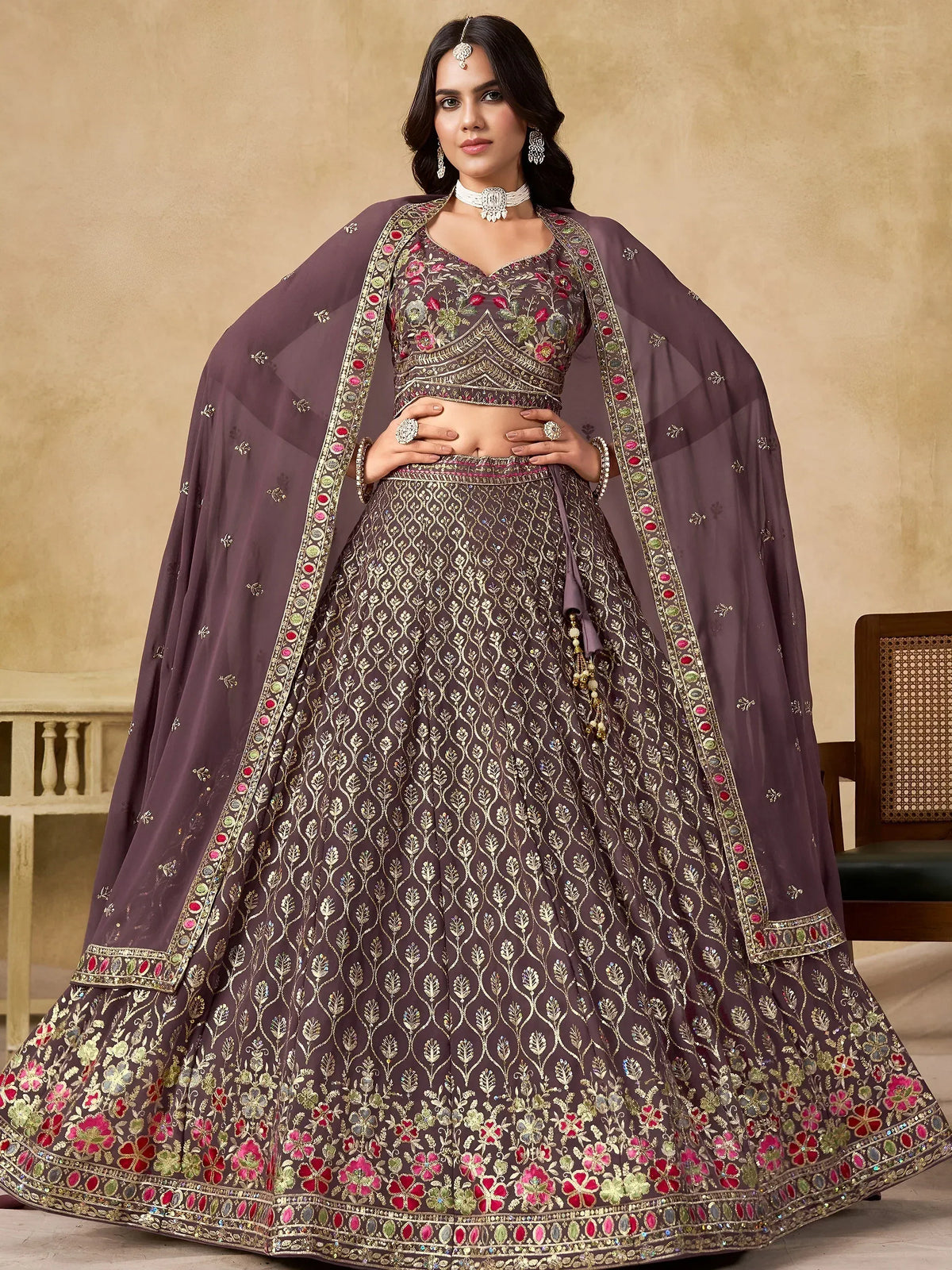 Elegant purple lehenga choli with gold floral embroidery and matching dupatta for Indian weddings