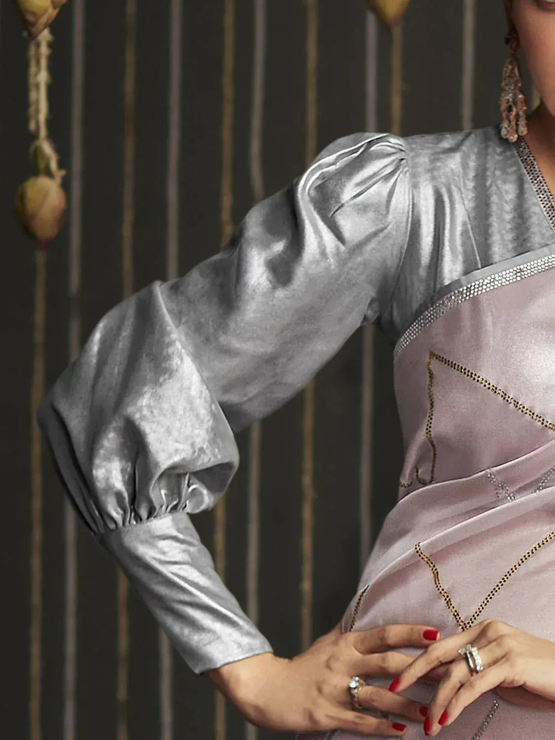 Silver velvet ethnic gown with puff sleeves and gold embroidery, perfect for Indian occasions.