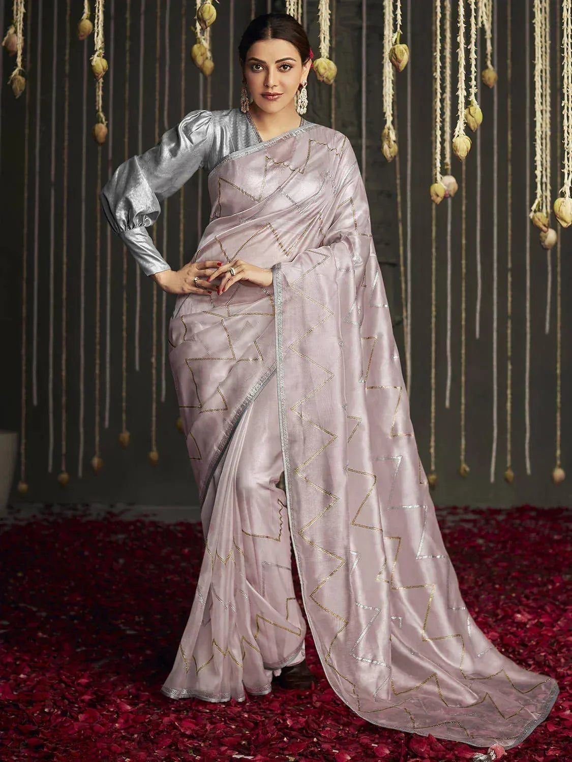 Elegant lavender saree with gold geometric embroidery, paired with silver blouse, perfect for Indian ethnic occasions.