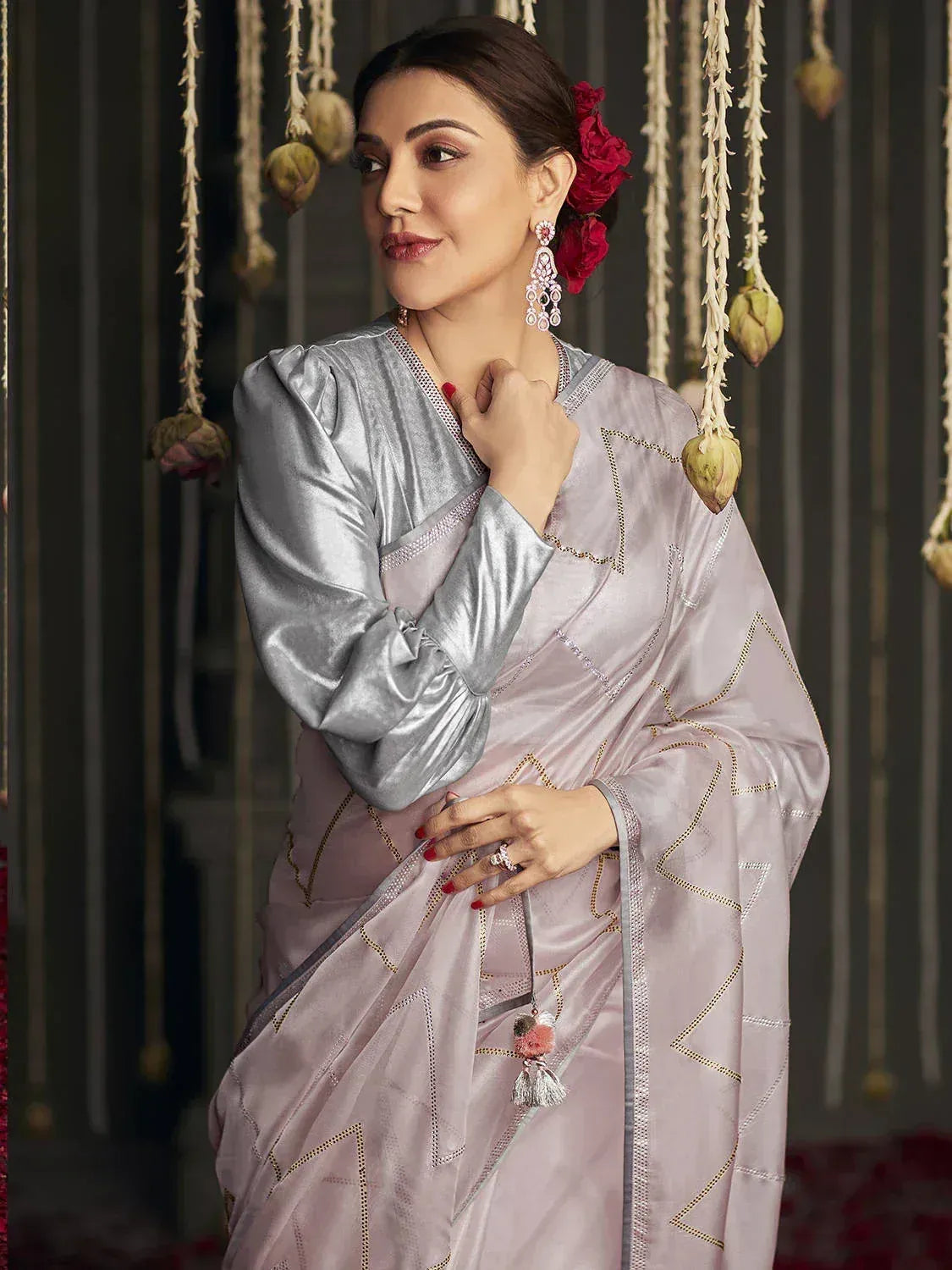 Elegant lavender saree with gold geometric embroidery, paired with silver blouse and floral hair accessory