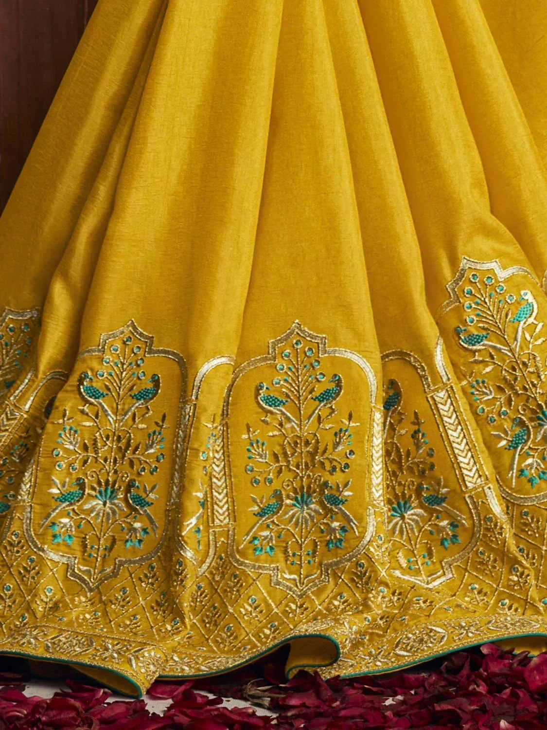 Yellow lehenga with peacock embroidery and gold detailing, perfect for Indian ethnic wear