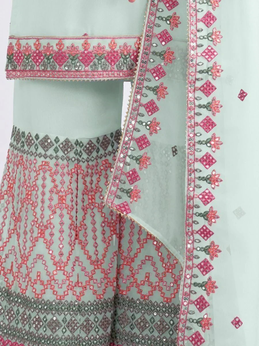 Light green ethnic dress with pink and grey geometric embroidery and sequin details