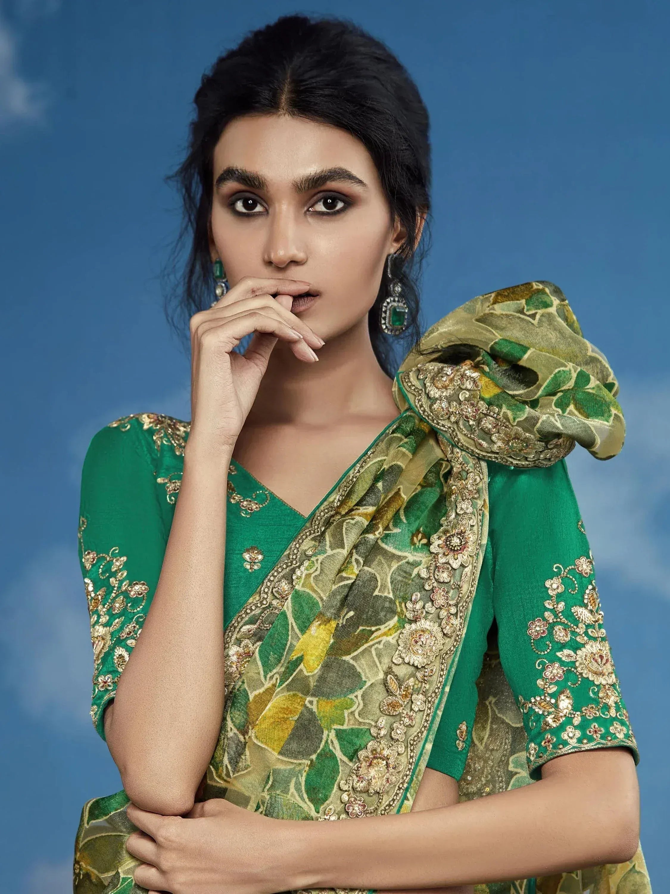 Elegant green embroidered saree with floral dupatta, perfect for Indian ethnic wear occasions.