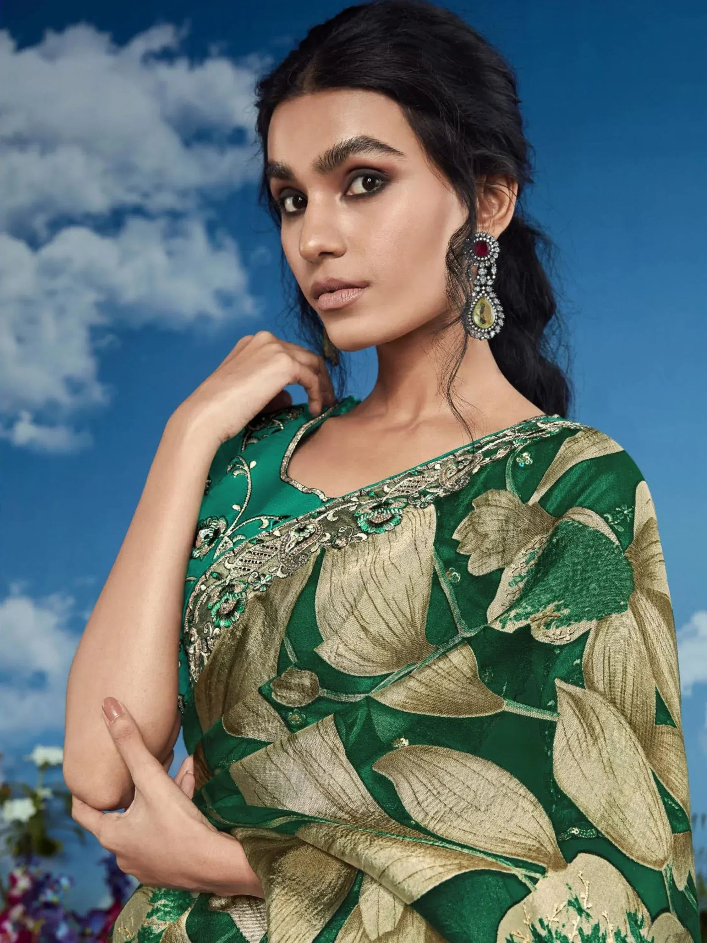 Woman in green and gold floral saree with intricate embroidery, perfect for Indian ethnic occasions