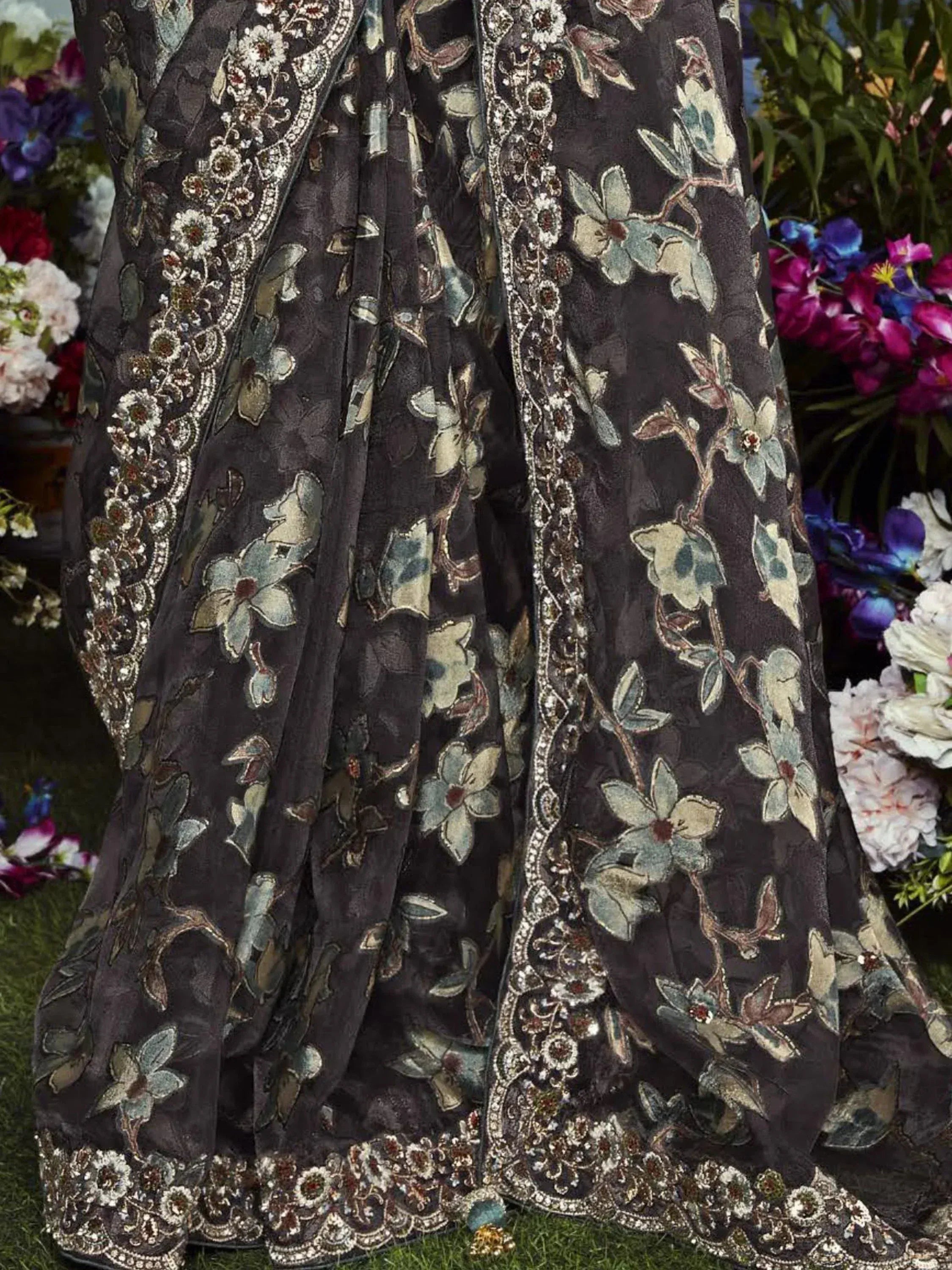 Dark grey floral embroidered lehenga with intricate gold and silver threadwork, perfect for Indian ethnic wear.