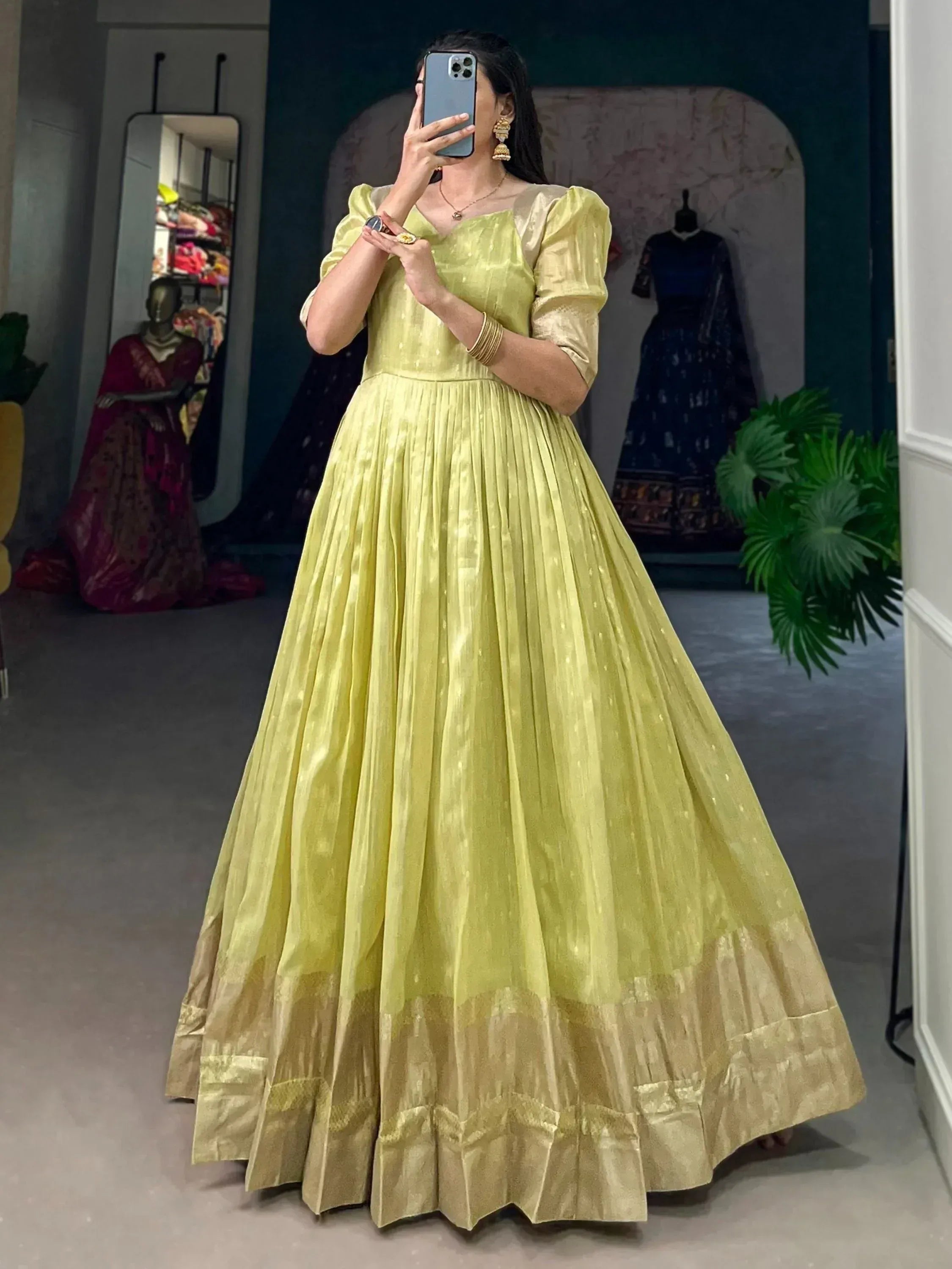 Lemon green ethnic gown with puff sleeves and pleated skirt, perfect for Indian weddings and parties
