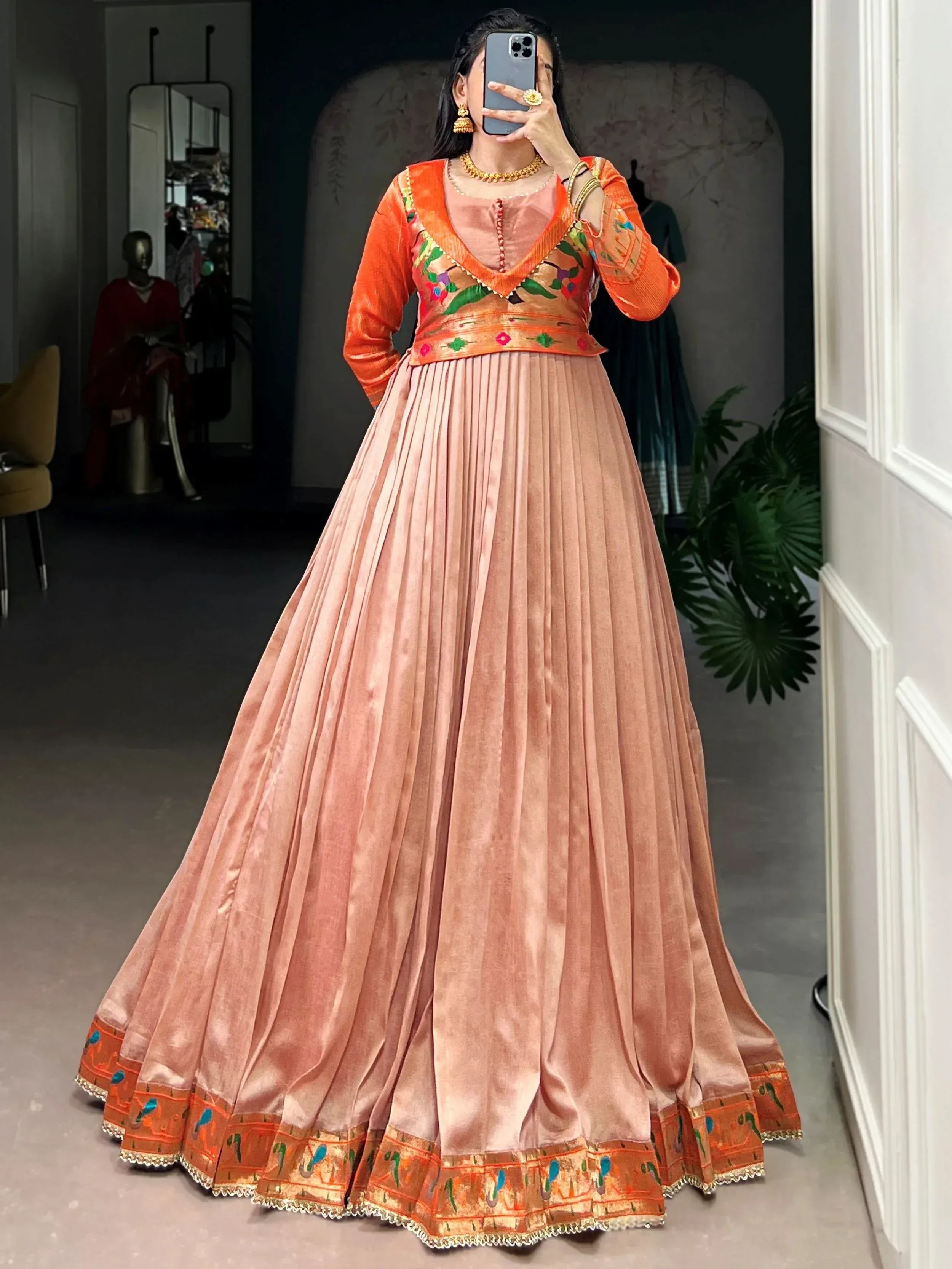 Captivating Peach Zari Weaving Silk Function Wear Gown