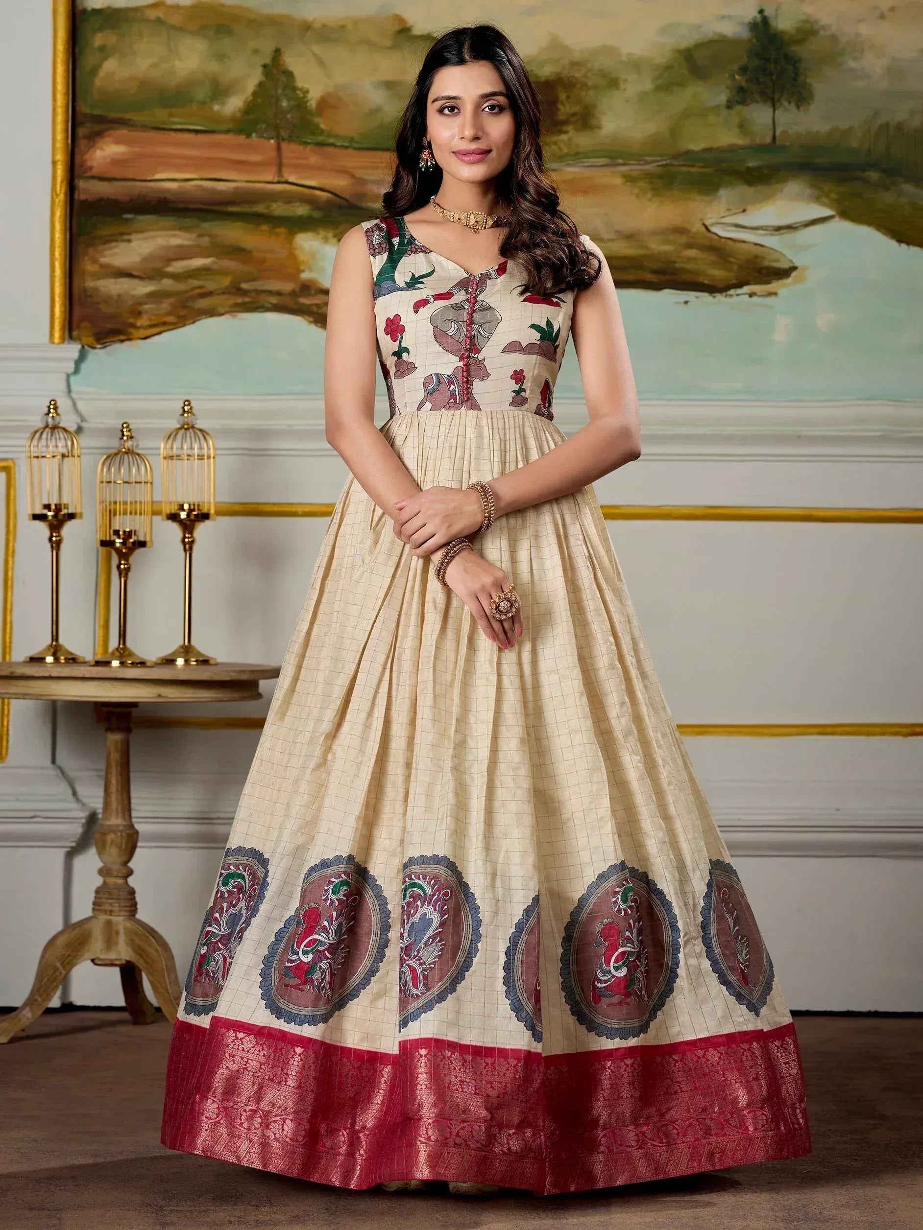 Beige ethnic gown with elephant print and red border, perfect for Indian occasions