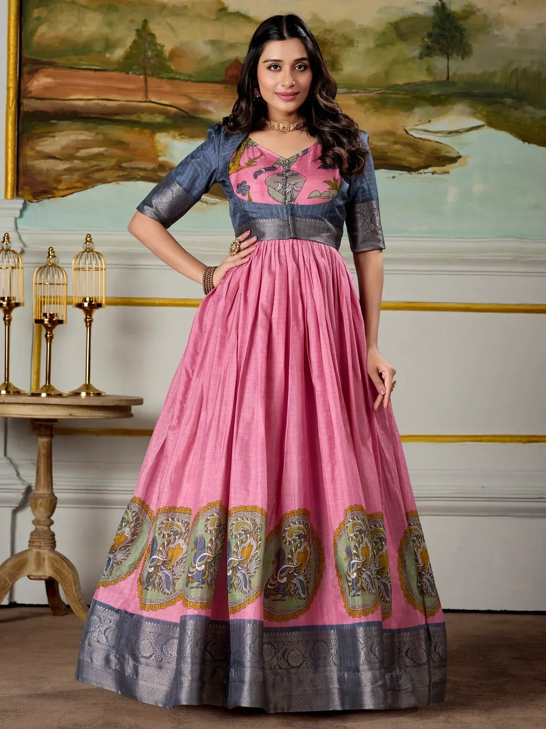 Pink and blue ethnic gown with elephant print and paisley border, perfect for Indian occasions