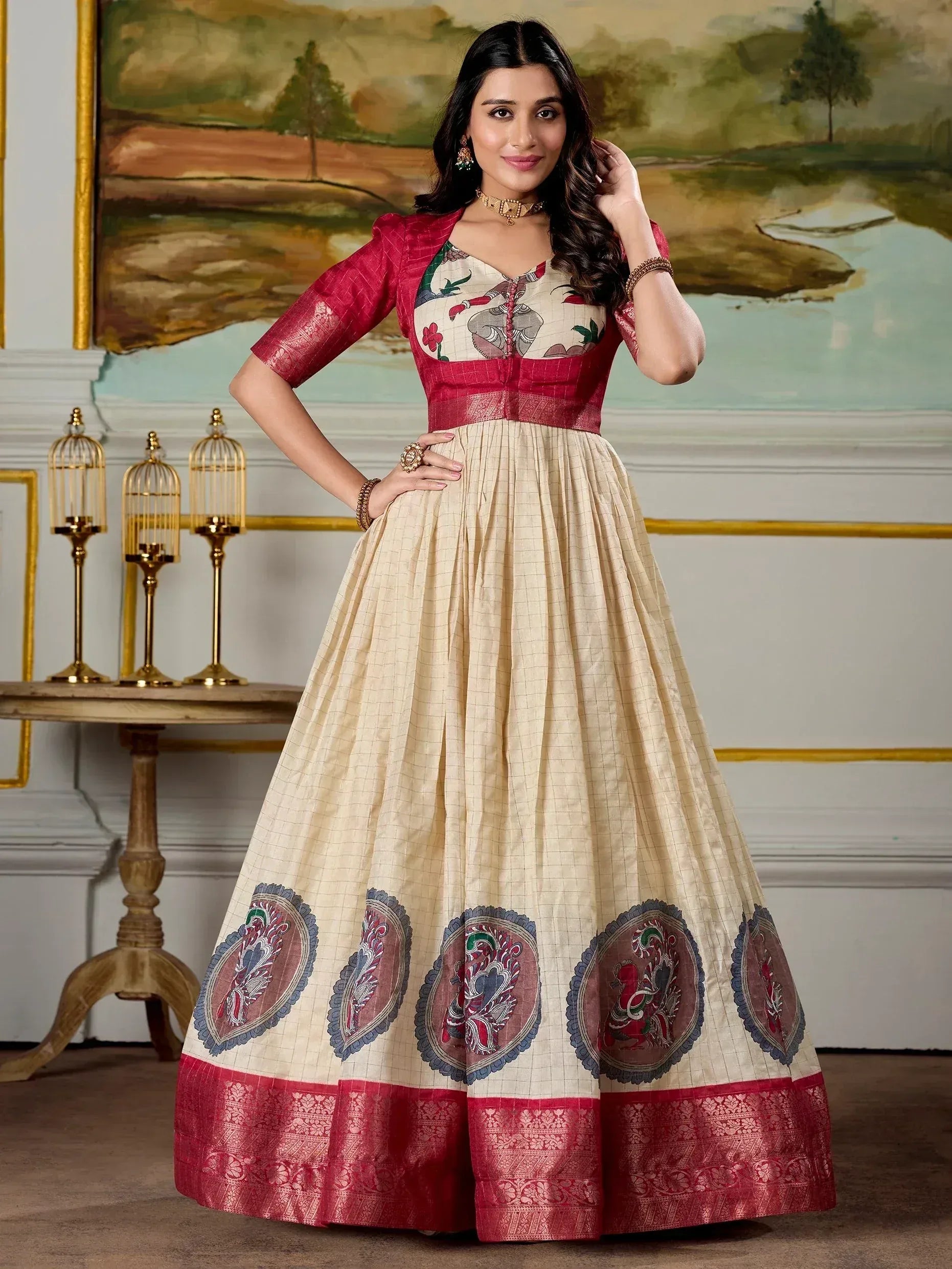 Cream and red ethnic gown with elephant print and embroidered border, perfect for Indian festive occasions