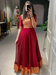 Alluring Maroon Zari Weaved Silk Festive Wear Gown