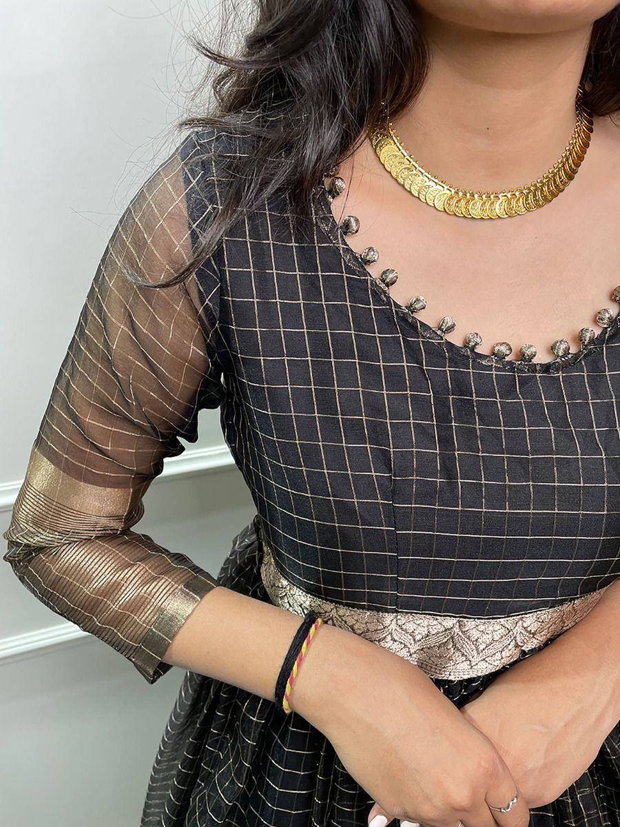 Black checkered ethnic gown with sheer sleeves and gold coin necklace
