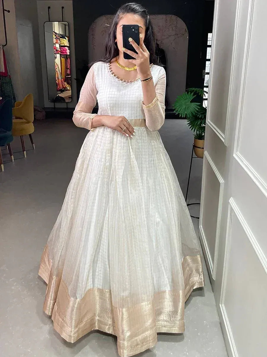 White ethnic gown with gold border, perfect for Indian occasions and festive wear