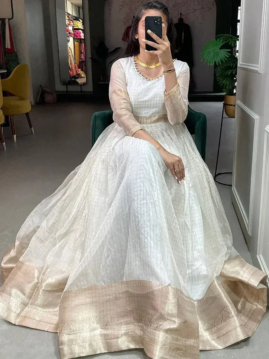White ethnic gown with gold border, perfect for Indian occasions and festive wear