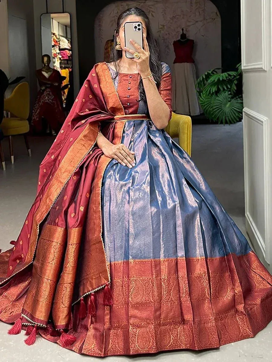 Woman in blue and maroon designer lehenga choli with silk dupatta, ethnic Indian wear