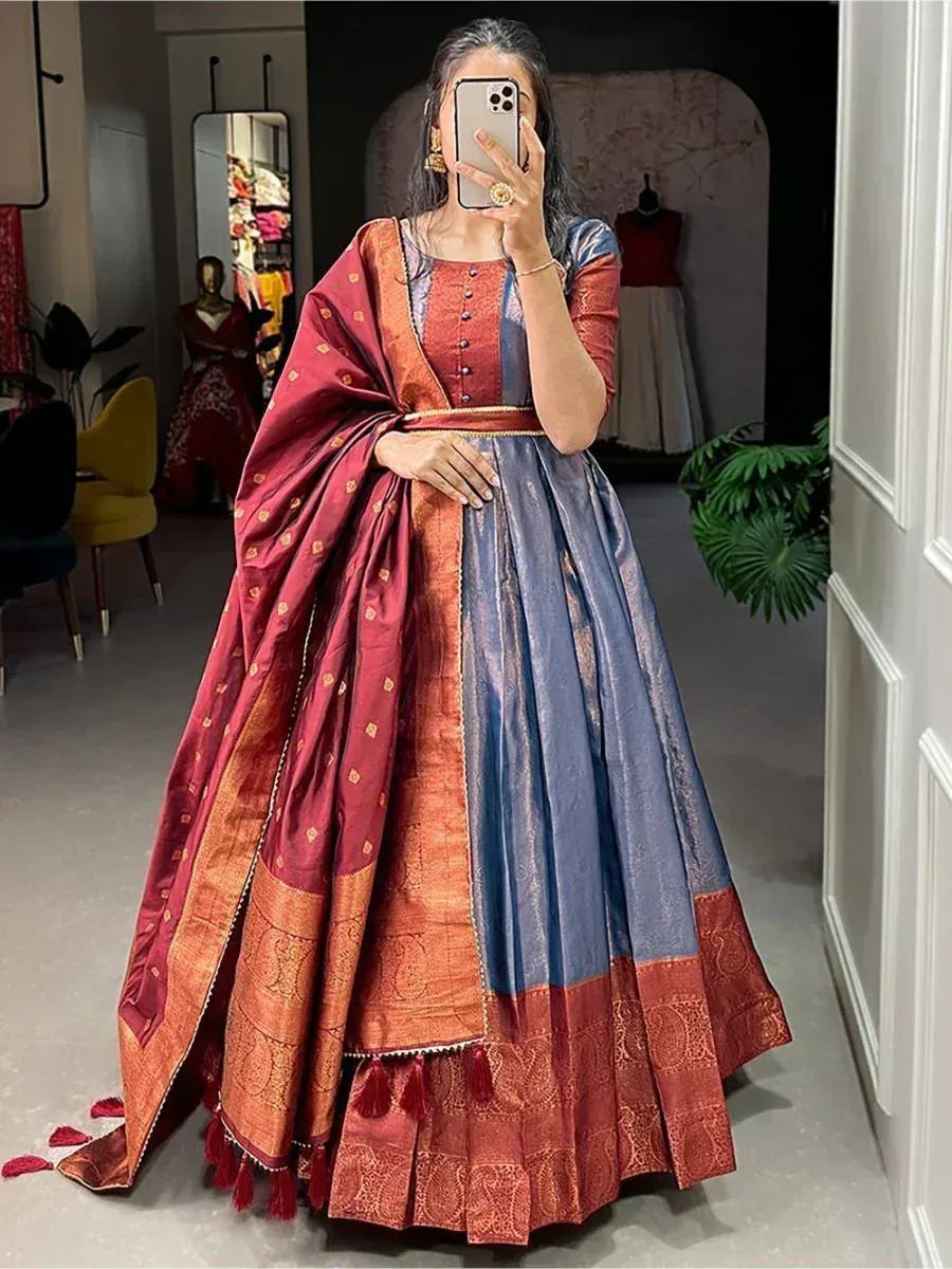 Woman in red and blue designer lehenga choli with gold embroidery, perfect for Indian ethnic wear occasions