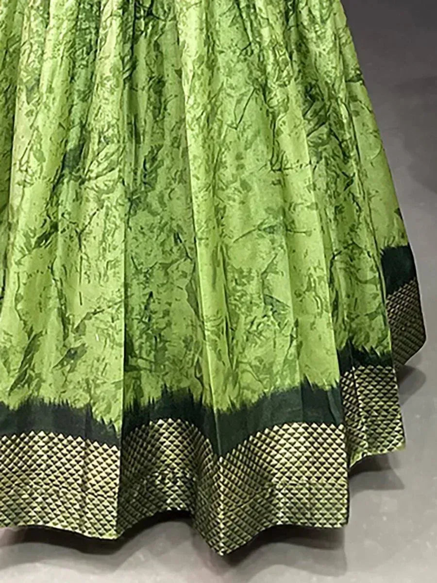 Green floral printed lehenga skirt with geometric border, ethnic wear for women